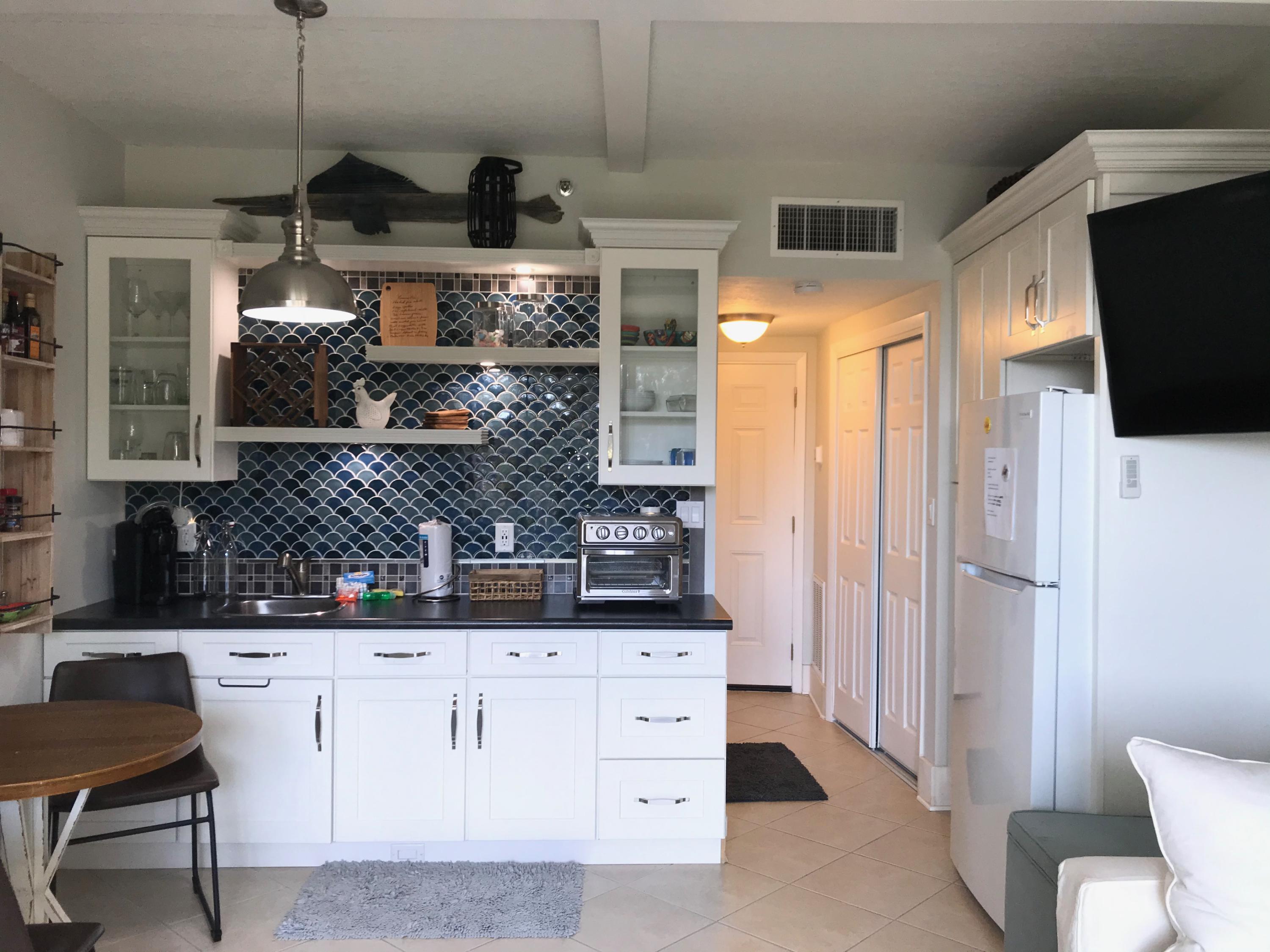 Nicely renovated desirable first floor unit. Three patios away from entrance to swimming pool. No elevator to wait for :o) Located on the west side of the Olive Garden. This unit includes ''assigned right to use'' boat slip #D18....up to a 36' boat with a 10,000 lb lift. Boatslip B2 no longer is assigned to this unit. Call your favorite Realtor today to schedule a showing!Fish wood and metal sculpture on top of kitchen cabinets does not convey. Thank you! Buyer is responsible for personally verifying details about this property. Any information contained in this listing is believed to be accurate but is not guaranteed. NOTE: Buyer understands that it is the intent of the seller to dispose of this property as a portion of a 1031 Tax Deferred change at no expense to the Buyer.The buyer agrees to cooperate by accepting instructions and/or addenda required in connection with the exchange, but without liability for said exchange.