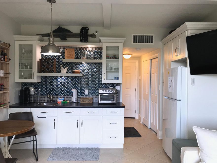 Nicely renovated desirable first floor unit. Three patios away from entrance to swimming pool. No elevator to wait for :o) Located on the west side of the Olive Garden. This unit includes ''assigned right to use'' boat slip #D18....up to a 36' boat with a 10,000 lb lift. Boatslip B2 no longer is assigned to this unit. Call your favorite Realtor today to schedule a showing!Fish wood and metal sculpture on top of kitchen cabinets does not convey. Thank you!  Buyer is responsible for personally verifying details about this property. Any information contained in this listing is believed to be accurate but is not guaranteed. NOTE: Buyer understands that it is the intent of the seller to dispose of this property as a portion of a 1031 Tax Deferred change at no expense to the Buyer.The buyer agrees to cooperate by accepting instructions and/or addenda required in connection with the exchange, but without liability for said exchange.