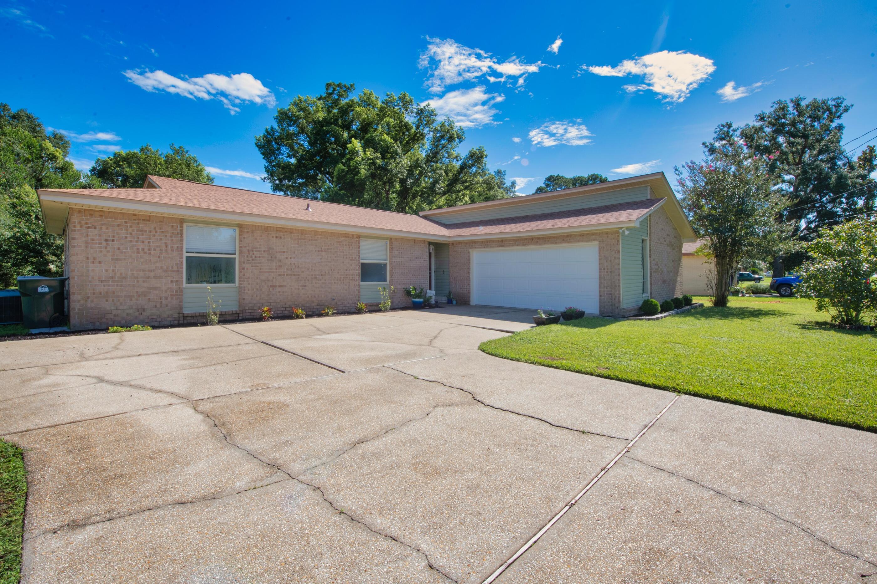 Welcome to Pine Forest! This home is situated on a beautiful, large lot in an established neighborhood with mature trees. This spacious brick home has everything you need! BRAND NEW ROOF. 3 bedrooms and 2 bathrooms with a split floor plan, HUGE Florida room with heat and A/C, cozy living room with fireplace, tons of storage in the oversized laundry/utility room, whole-home water filtration system, reinforced garage door, large driveway with extra parking space, power shed with A/C and more! If you like to Kayak, Lake Francis access is just a couple of blocks away. No HOA, only a voluntary lake preservation committee. Convenient location about a mile from Blue Angel Pkwy and I-10. Easy drive to shopping, Navy Fed CU, NAS, downtown, and a short drive from our famous white-sand beaches.
