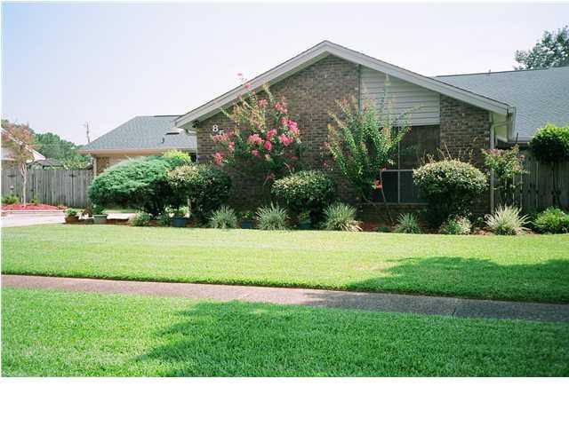 Location, location, location! Within walking distance to Santa Rosa Mall. Charming 4 bedroom home features an eat-in kitchen, seperate dining room and living room with fireplace, den and sitting room. Split bedroom plan with Master bedroom on the first floor with French doors leading to the back yard. Two more good sized bedrooms downstairs. Upstairs features one large bedroom with a large closet. Back yard is privacy fenced and has an in-ground pool and deck. There is also a lawn pump and sprinkler system.