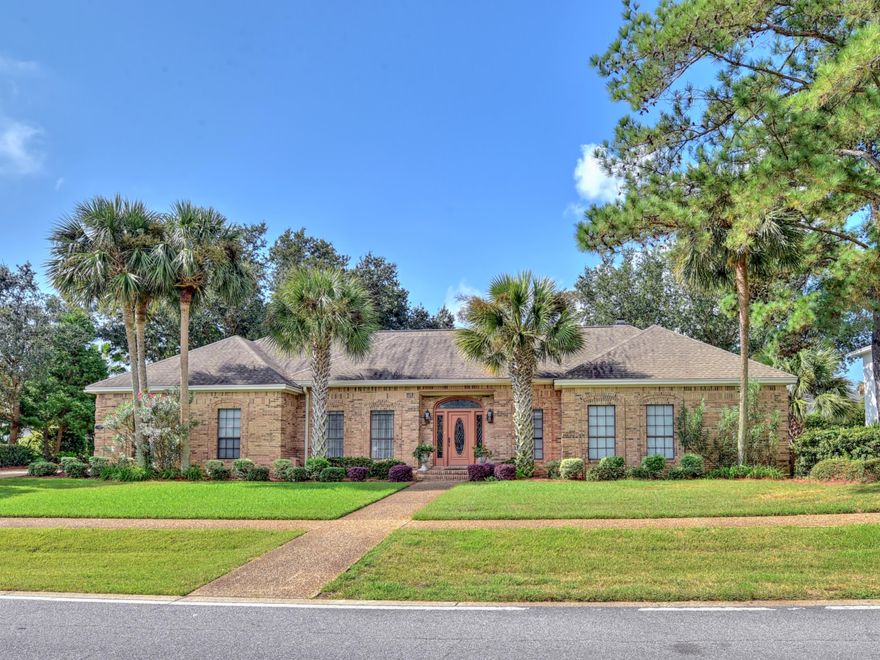 This custom built brick home is located in the golf course community of Indian Bayou and is close to the sugar white sands and crystalline green waters of the Emerald Coast. This home is on a large lot and features a lovely pool and lanai area. The home has a FULL HOUSE GAS GENERATOR . The kitchen has custom built cabinetry, a sub-zero refrigerator, double ovens, smooth top surfaces and a cooktop on the island which is open to the den that has more beautiful custom cabinetry. The front entry is adorned with columns and the Large living room has a gorgeous fireplace and sliding doors that open to the lanai. The master bedroom has custom drapes. The master bath has gratnite counters and double vanities. Seller is providing a home warranty. Buyer to verify all lot and home dimensions.