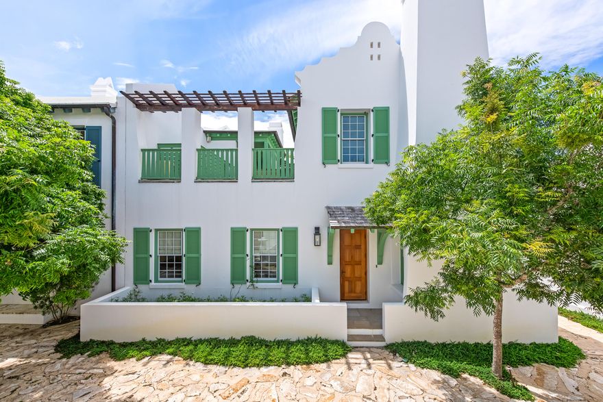 Fronting the Sea Garden Pedestrian Path and Mojito Alley in Alys Beach, this 2,739-square-foot courtyard home delivers strong architectural presence and functional design. The 20-foot vaulted living room ceiling brings in natural light and creates a feeling of openness. Hickory floors and honed granite countertops add warmth and texture to the streamlined interiors. A fireplace nook anchors the main living area. French doors from both the living room and first-floor primary suite open directly to the private courtyard. Designed for year-round use, the courtyard includes a dipping pool, built-in seating, and an outdoor fireplace surrounded by mature greenery.Upstairs, two guest suites connect through a louvered gallery and open onto a spacious rooftop terrace overlooking the landscaped pedestrian pathway.
Balanced architecture, defined spaces, and seamless indoor-outdoor flow make this home a strong courtyard offering.

 Furnishings will accompany the sale of this property. This home is built to "fortified for safer living" standards.
