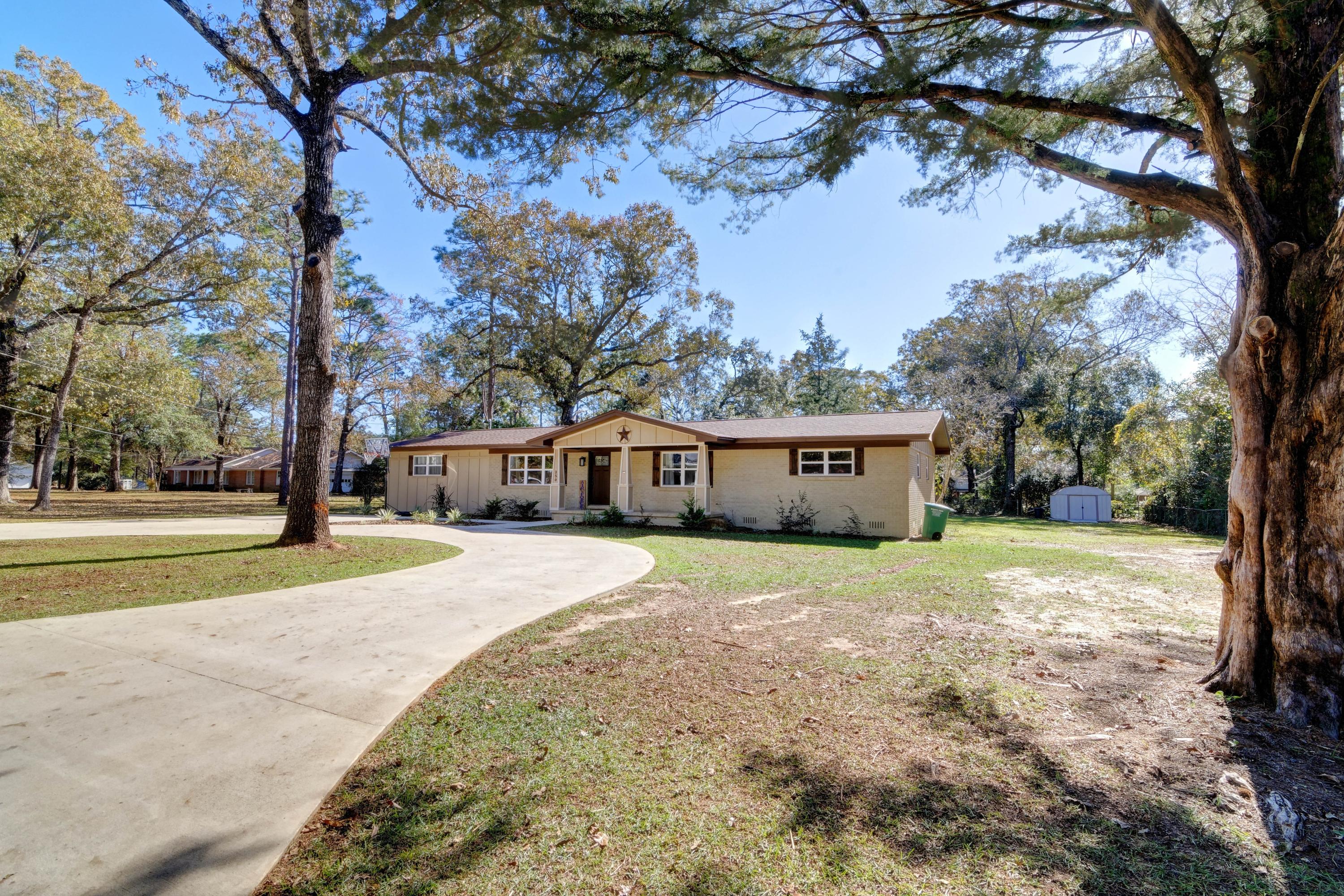 Welcome to this COMPLETELY remodeled (inside and out!) 4 bedroom, 3 bathroom home on a fantastic 0.44 acre lot! From the time you drive up into the massive circled driveway you'll fall in love with this charming home. Remodeled in 2019 to include all new windows, new interior and exterior doors, new plumbing, new electrical, new room, new appliances, HVAC, etc you will have peace of mind knowing you're getting a better than new home! Enter inside and appreciate the laminate wood flooring that extends throughout with tile in all the wet areas. Granite countertops grace the recently remodeled kitchen with all new cabinetry, appliances, and a deep kitchen sink. Enjoy a massive master bedroom (check out the barn doors!), and three other spacious bedrooms. The back bedroom even features