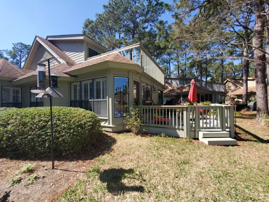 Highly sought after Fairways cottage nestled on a large lot with a peaceful, serene lake view. The original screened porch has been fully enclosed to create a wonderful Florida room surrounded with windows showcasing the lake. Recent updates: HVAC 2021, water heater 2020, windows 2020, shiplap accent wall 2020, new landscaping 2020, large back deck 2018, exterior storage room 2018, and interior/exterior paint 2018. The new oversized brick paver parking pad with golf cart charging station can easily fit two full sized cars with a golf cart. The kitchen has been updated to include stainless appliances, granite counter tops, shaker style white cabinets, and a tile backsplash. Also enjoy the smooth ceilings with crown molding on the main floor, plantation shutters, and hard surface flooring