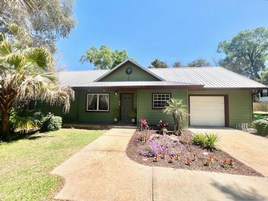 Available June 17!!! **Pets considered with owner approval.**Step into this exceptional residence nestled in the heart of Niceville, where modern convenience meets timeless elegance. Featuring stainless steel appliances and a tankless hot water heater, this home is designed to enhance your everyday living experience. Newly installed weathered oak LVP flooring throughout adds a touch of sophistication, creating a space that exudes charm and craftsmanship. The spacious bedrooms offer ample room for rest and relaxation, while the primary ensuite includes a luxurious walk-in closet, providing the perfect retreat after a long day. Additionally, the property boasts a spacious workshop and greenhouse, providing endless opportunities for hobbyists and enthusiasts alike.*Pets Considered