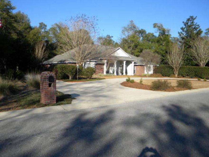 What a beauty! Come take a look at this custom built house situated on over 1.3 acres on private corner lot with woods on 3 sides in lovely Ashley Place. You won't be disappointment. House features include covered front porch and back porch with ceiling fans, overlooking 13x26 covered pool for relaxing and entertaining. There is also outdoor shower, pool storage room, ceiling fans and outdoor speakers. Other features include 3 car garage, sprinkler system, circular drive, brick mailbox, extensive landscaping to include lighting. Interior features include formal dining room, large family room with built in bookcases, 2 fireplaces, beautiful custom kitchen with island, double oven, maple cabinets with glass doors, stainless appliances, vegetable sink, and granite counter tops.