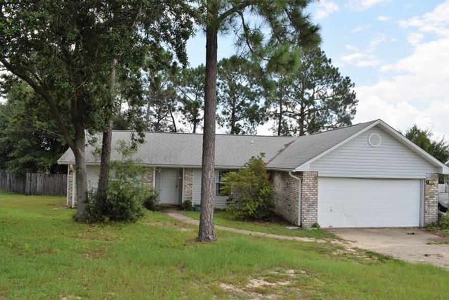 Real Estate Owned REO in a great location south of I-10. Short commute to all points south to include Eglin, Duke and beaches, also close to town for shopping, medical facilities and schools. This 3 bedroom, 2 bath features a living room that is a good size with a sliding glass door to the back Florida room. The tiled kitchen is large and has a center island and there are plenty of cabinets. Double vanity sinks in the tiled master bath, not to mention separate walk in closets. Call to schedule your appointment.