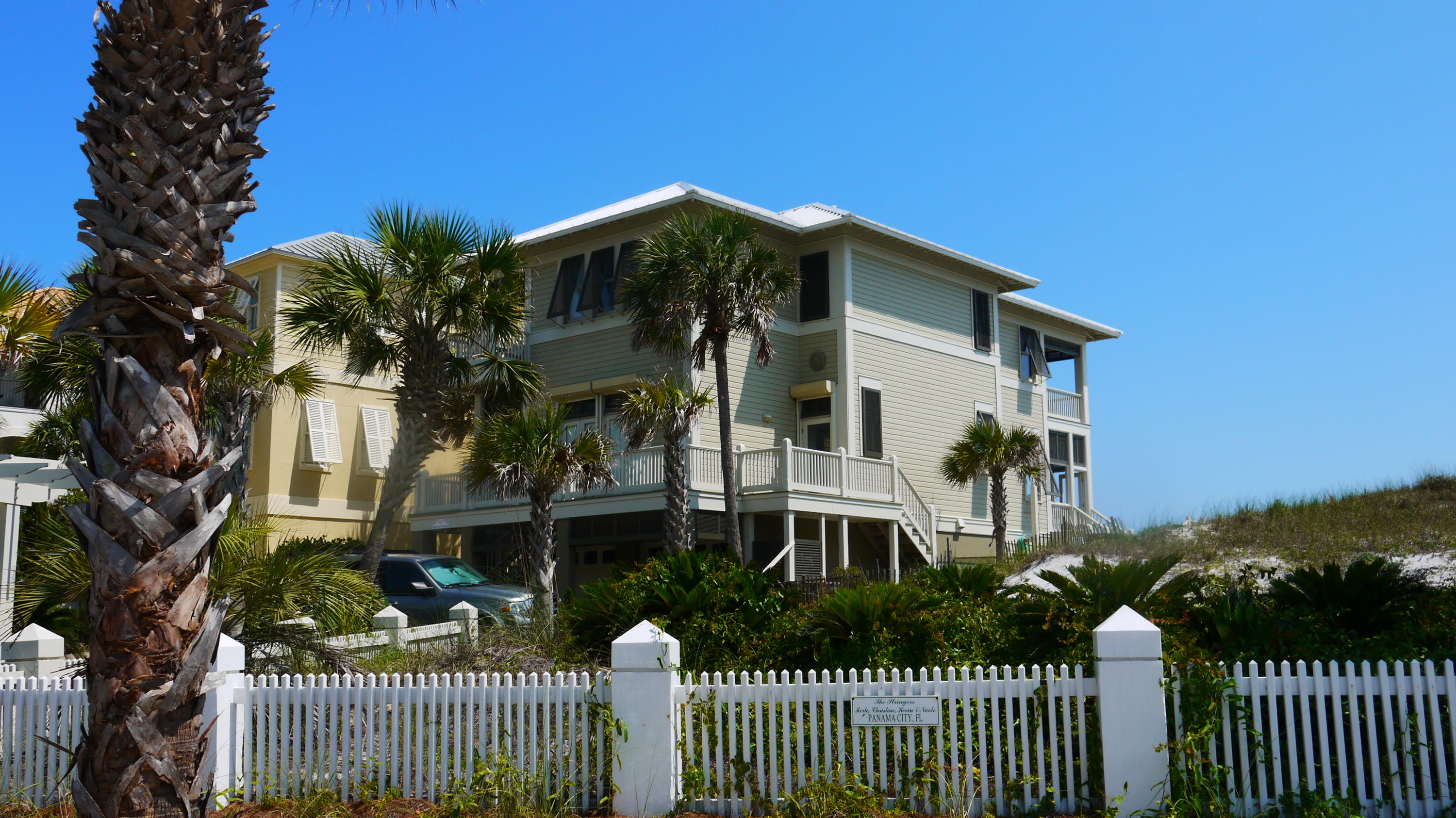 Permanent is the quintessential family beach home. Sitting atop a pristine sugar sand dune, overlooking the turquoise waters of the Gulf of Mexico, this home has everything a family could ask for in the perfect beach home. There is a large parking area opening into an over-sized double garage on the first level, along with a separate storage/workshop area and a private elevator entrance, so you don't have to take the stairs if you chose not to do so. The first living level consists of a very large living room with fireplace and built in shelves and cabinets, spacious kitchen with island and gulf views, large laundry room, dining area and wet bar (also with gulf view). In addition, there is a master suite on that floor and a powder room. The third floor consists of an additional