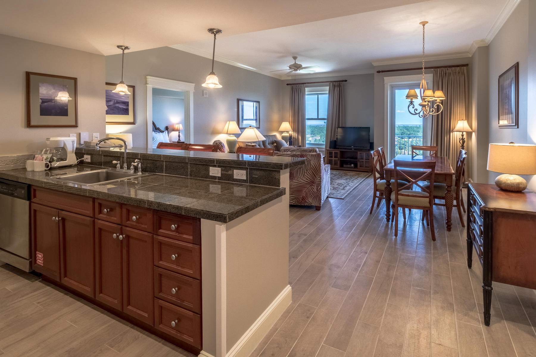 Wow! The Bay & Resort views are breathtaking from this top floor Grand Sandestin condo! Enjoy the privacy of only 4 units on the 11th floor. As you walk in, you are greeted with updated porcelain plank tile flooring, freshly painted interior, crown molding, granite counters with stainless steel appliances and a nice split floor plan with virtually 2 master bedrooms. Relax outdoors on the covered balcony while gazing at the Bay & Resort views. The Grand Sandestin welcomes you with gracious architecture and luxurious amenities including a fitness center, swimming pool, on-site check in, a concierge and valet parking, and Ballyhoo bar and lounge. Also enjoy being adjacent to the Village of Baytowne Wharf with lots of shopping, dining, and daily & nightly activities for the whole family.