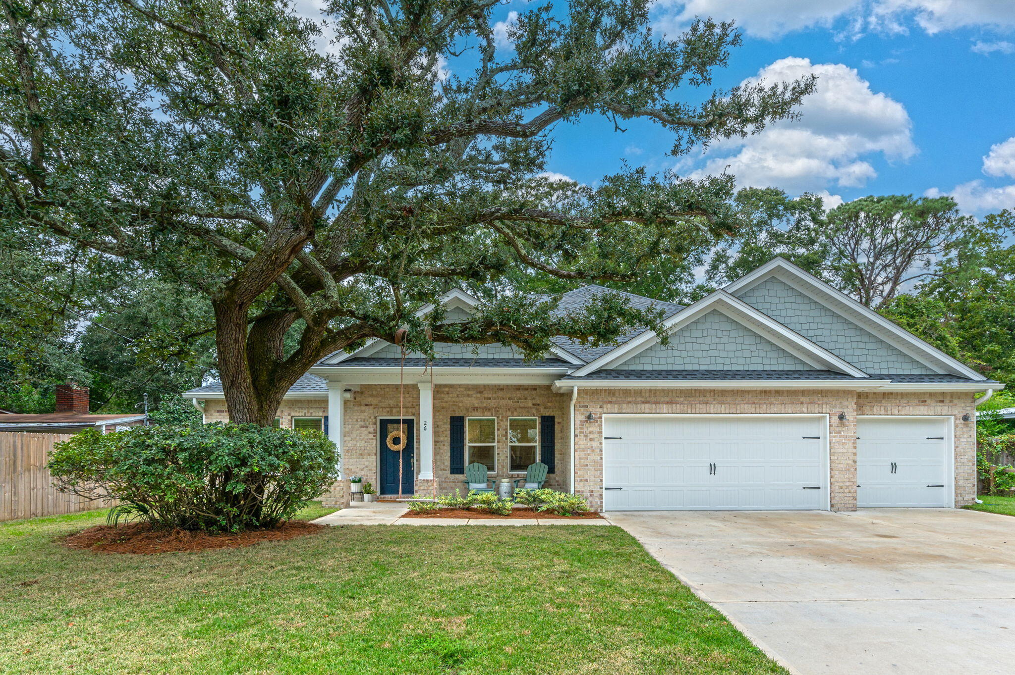 Discover modern coastal living in the heart of the coveted downtown Fort Walton Beach neighborhood of Elliott Point with this stunning 2023-built home. This 5-bedroom, 3-bathroom home + 3 car garage spans an impressive 2,650 square feet of thoughtfully curated space. Every detail reflects a perfect blend of elegance and functionality, making it the ideal retreat for hosting gatherings and creating cherished family memories. At the center of the home is a bright and airy open floor plan, anchored by a modern coastal kitchen that is as stylish as it is practical. Featuring a striking coastal blue chevron tile backsplash, white quartz countertops, and brand-new stainless steel appliances + a gas range. This entertainers kitchen is the heart of the home. Adjacent to the kitchen, a mudroom with a built-in bench seat seamlessly transitions to a well-equipped laundry room complete with a sink and custom cabinetry, ensuring organization is effortless.
The split floor plan offers privacy and tranquility in the primary suite, which boasts a spa-inspired ensuite complete with a standalone soaker tub, double vanity, and a sleek glass-enclosed shower. On the opposite side of the home, three spacious bedrooms are thoughtfully arranged, with two sharing a Jack-and-Jill bathroom and the third designed as a guest suite. A versatile fifth room at the front of the house, with French doors and a closet, functions perfectly as a home office or additional bedroom.
Ample storage is a key feature, with numerous closets throughout, complemented by a three-car garage and an oversized driveway to accommodate family and guests effortlessly.
This home's location is equally exceptional, just steps from Downtown Fort Walton Beach, where you can walk, bike, or take a golf cart to year-round festivals, dining, and entertainment. With public water access just 2 blocks away, paddleboarding or walking your dog along the Choctawhatchee Bay becomes part of your daily routine. A public boat launch and several nearby parks and playgrounds further enhance this vibrant, active neighborhood.
If you're looking for a home that perfectly balances coastal charm, modern convenience, and peace of mind, this is it. Welcome to your dream home in Elliott Point!