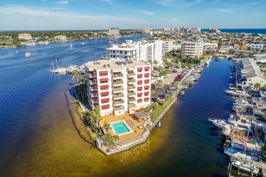 Pristine views of emerald green waters and tranquil vistas of the iconic Destin harbor highlight this gorgeously renovated two bedroom, two bath top floor unit at the gated and exclusive community of Destin Harbor West. This unit also has a deeded boat slip capable of accommodating a 45' vessel as well as a spacious owner's closet that both convey with the sale. Primely situated and aptly named, Destin Harbor West is an exclusive gated residence with an ideal location; the pool directly overlooks the Destin harbor and the building also recently underwent a major renovation to the lobby creating a tasteful and luxurious atmosphere yielding a pristine sense of arrival.