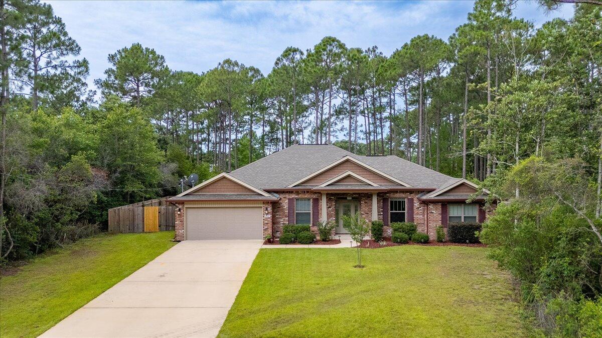 This 3 BR/2BA 2020 built home is located at the end of a small, peaceful, cul-de-sac surrounded by nature * Easy access to the east entrance of Holley by the Sea. * 10' ceilings in main living areas * Leaded glass front door with transom window & 2 sidelights * Large windows through-out the main living areas with 8' glass rear door for plenty of natural light. * LVP flooring main living areas & baths * Dining Room * Living/Flex Room * Window Blinds * Split bedroom design * Large master bedroom * Master bath with tiled walk-in shower/soaking tub/double vanity/walk-in closet. * 2 other bedrooms are on oppositive side * Screened in Lanai * Paved patio for entertaining * Fenced Yard * Gutters front & back * Motion floodlights lights on rear * Irrigation system on well * On sewer *