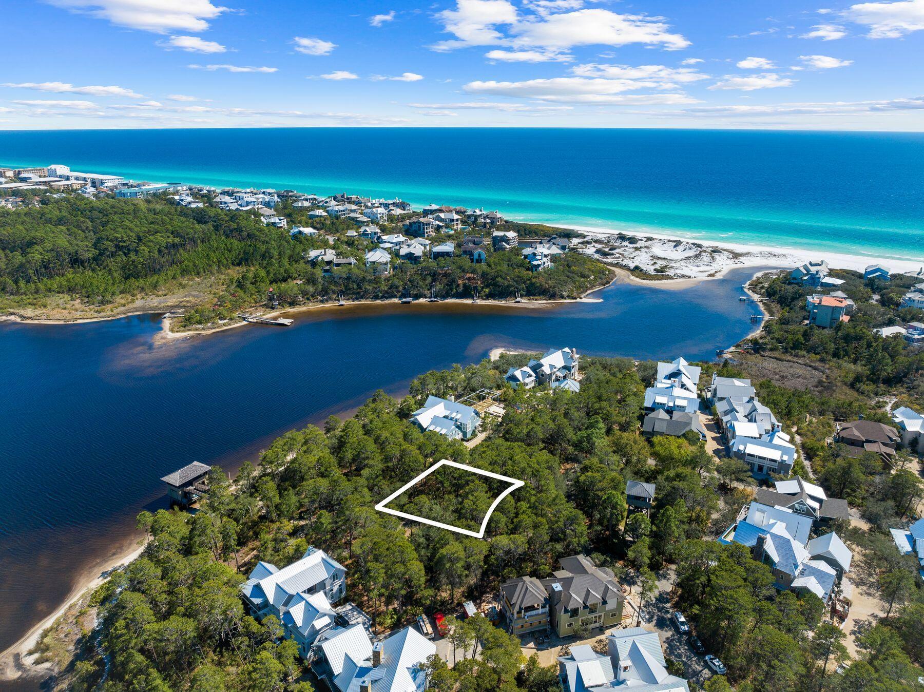 Situated within the peaceful ambiance of Draper Lake Coastal Village, this type I street house homesite, Lot 8-1, invites those in search of a picturesque setting to create their dream abode. Positioned on the western peninsula, just east of the observation tower, this corner lot offers enchanting views of the lake and potentially even glimpses of the gulf. Embrace the essence of coastal living in this distinctive community, meticulously designed by the renowned architects at Dover, Kohl & Partners. Here, residents can enjoy the amenities of two boathouses, two swimming pools, direct lake access, well-manicured parks, nature trails, and a 45-ft. observation tower. The gated community provides a serene retreat, ideal for primary or second homeowners seeking tranquility away from short-term rentals. Perfectly situated overlooking Tower Park and offering vistas of Draper Lake along the paved path to the western boathouse, this homesite presents an unparalleled opportunity to immerse oneself in the natural beauty of the area.