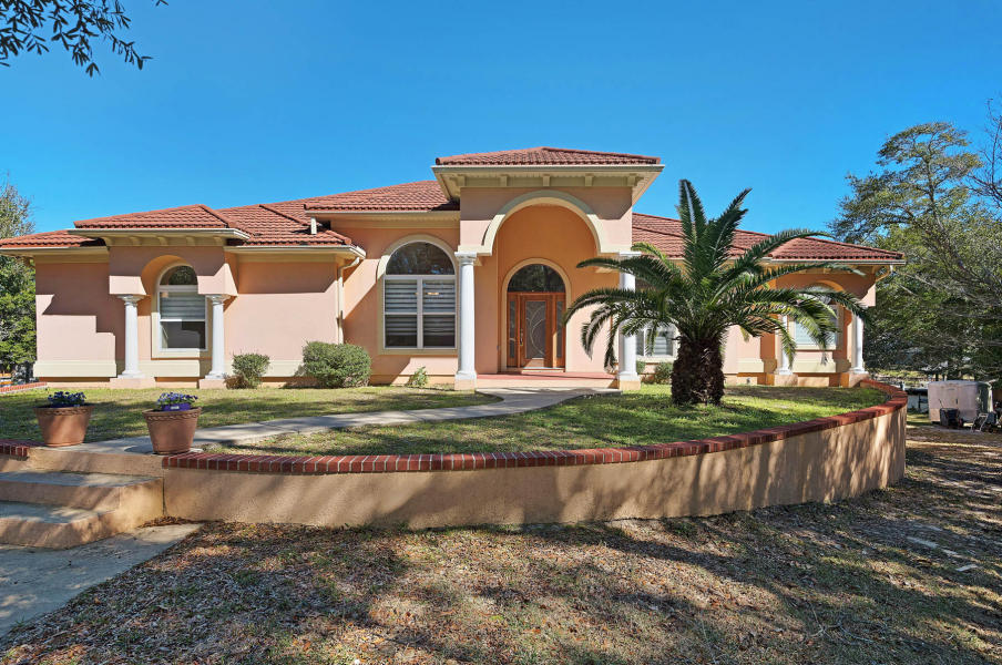 If you have been dreaming of a WATERFRONT home with DEEP WATER access to the bayou and beyond, look NO FURTHER. Enjoy the beautiful setting of this 5 Bedroom, 3 1/2 bath with oversized 3 CAR GARAGE at the end of the Cul de Sac. Home features a boat dock and lift so you can be out and enjoying the WATER in moments. The main floor features 5 bedrooms and 3 full baths. The 5th bedroom could function as an office with glass french doors. The upgraded kitchen features STAINLESS STEEL appliances (new pictures coming) and GRANITE counters. Out back is an expansive screened in patio to enjoy the views. Downstairs is a bonus media room and perfect work out studio. Call today to schedule your appointment 850.389.8533