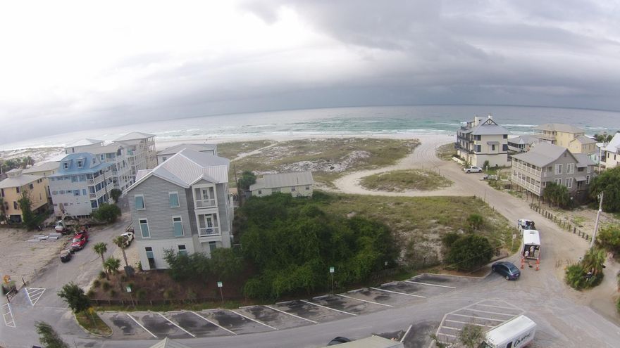 One-of-a-kind Gulf View lot with forever views. Lot adjoins Grayton Beach State Park and feels much larger than it is. Build your dream home on sizzling Hotz Ave. Chringo is across the street and the Red Bar is now open!  This is the historic area of Grayton Beach ... the New York Times declared this bohemian little village a group of eclectic folksy people that are ''Upscale but Unfussy!'' They all get along in a bygone era in a beach town whose moniker is ''Nice Dogs, Strange People!'' There is nothing like this anywhere on 30A...no customary use rules or private property rights to argue about ... your lot adjoins a State Park where all are welcome. The value of this lot is clearly the location to paradise. Drive by and see for yourself.Broker has ownership interest.