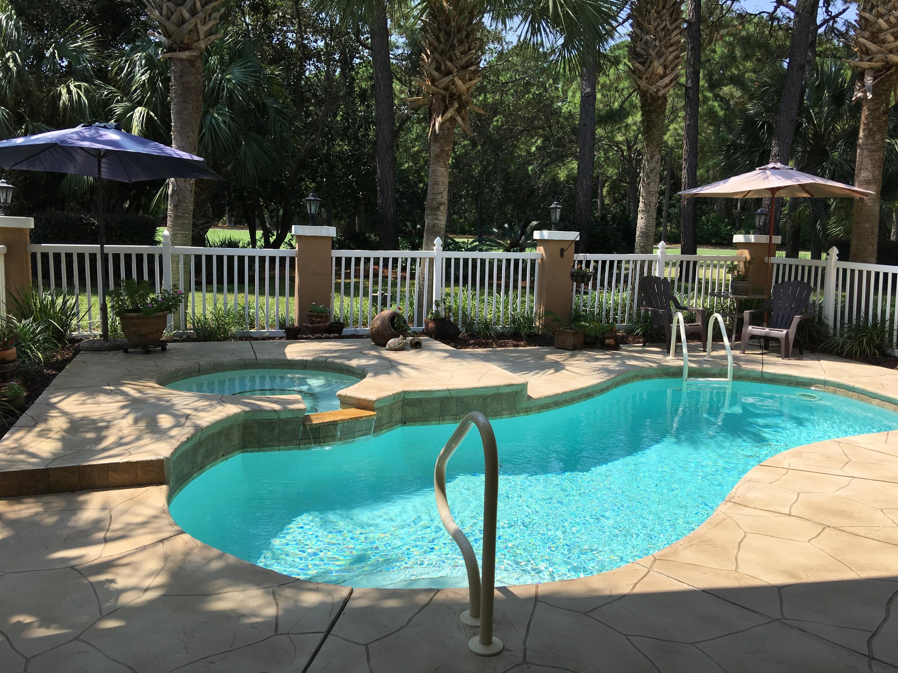 Tucked away on a cul-de sac street in the popular neighborhood of Indian Bayou, and sitting on an estate sized golf course lot, is a very beautiful and impressive Mediterranean styled Villa. This one story home has been totally updated and remodeled, has that popular open floorplan with cathedral ceilings, and is in move-in condition. Custom built of concrete and steel construction, it's finished to perfection. There are 4 bedrooms, 3 full baths, a gourmet kitchen with all professional grade stainless steel Viking appliances, vent hood with stainless backsplash, granite counters and many custom cabinets. The walls of glass throughout the home lets the light in and gives views of that sparkling, heated pool and spa. Truly one of the prettiest and serene spots overlooking the 5th fairway