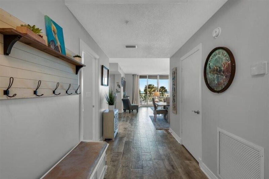 This 3br/3ba 1st floor condo has a second level view. It's tasteful pristine Coastal Cottage decor captures the essence of Navarre Beach. There is no comparison to the trend setting architecture, the spaciousness, the privacy, and the multiple exposures to the Gulf creating a life style like no other. This development is famous for its private entry ways, circular terraces overlooking the Gulf. Amenities include covered parking, Olympic size swimming pool, pickle ball and tennis courts, fitness room and social center with a full kitchen for entertaining.