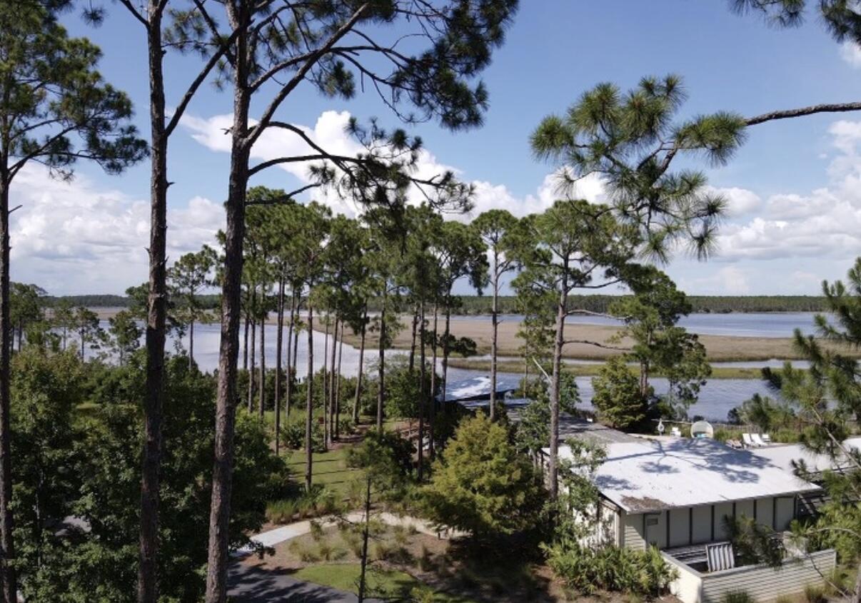 Beautiful Bay View lot located within the gated RiverCamps community. RiverCamps is an exclusive waterfront community. This nature oasis is surrounded by three stunning bodies of water and lush pine forest. While this community feels like a secluded retreat it is still only approximately 10 minutes away from the beach! This lot is the closest lot to the pool (currently under construction). As well as the boat day docks. You will be within a few steps of these luxury amenities! Amenities include access to West Bay and Crooked Creek, boat launch, Camp ground, and future pool and pavilion.