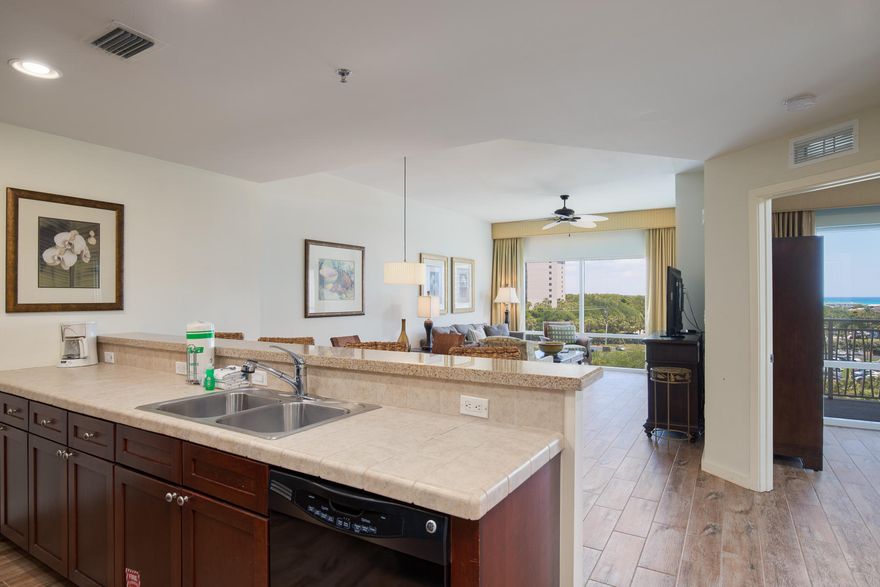 Largest Luau II one bedroom floor plan! 4th floor with Gulf views and new wood look tile - no carpet! This condo is fully furnished & rental ready with $25k of rental in 2019. LUAU features a large roof top observation area, a large heated pool with a swim-under waterfall & a heated spa. Fitness center is onsite making Luau a self-contained oasis. Located in this areas most complete resort with 4 Golf Course, tennis center, marina, restaurants & shopping.