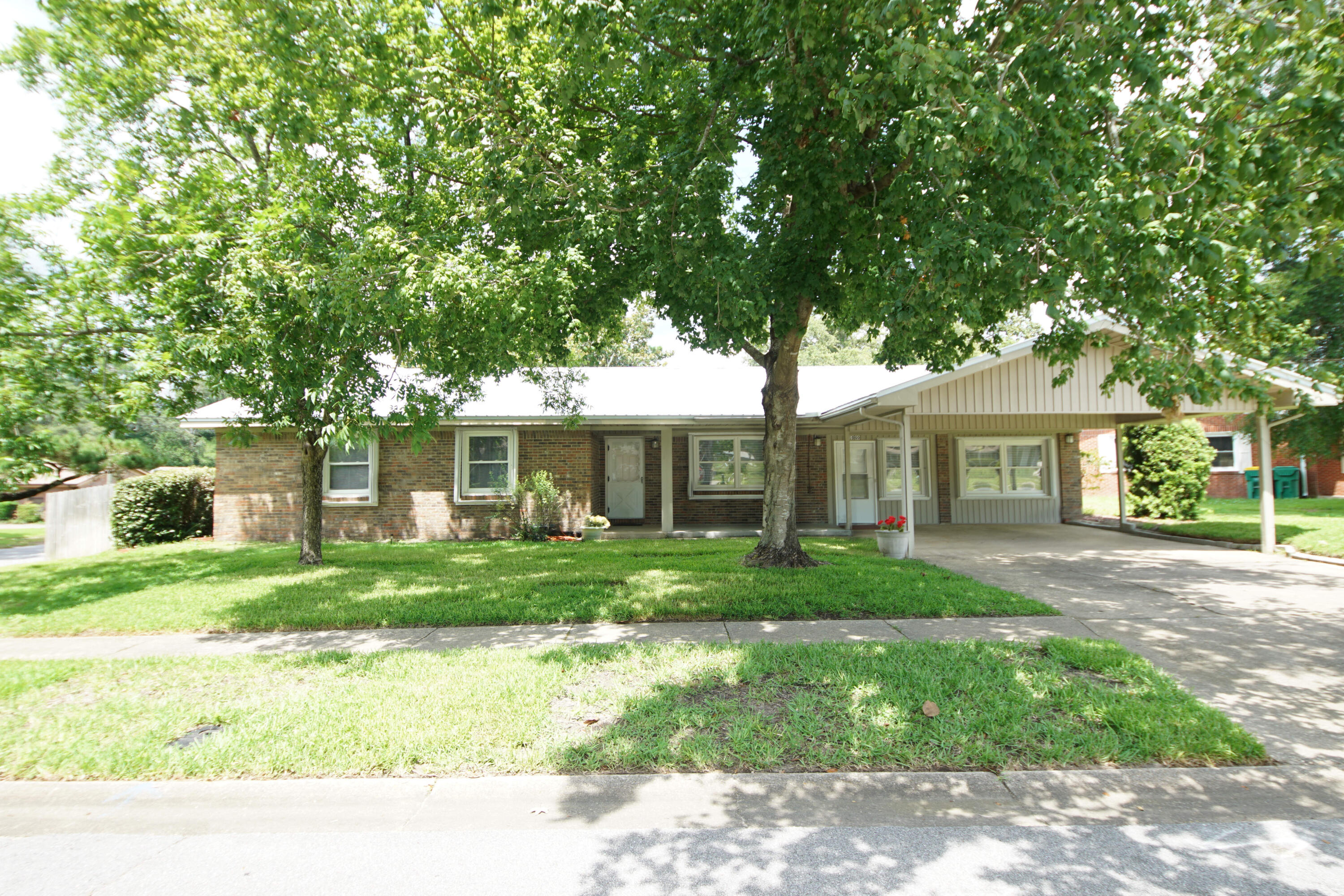 Great, 4 Bedroom, 2 Bath, Central Niceville Home, walking distance to schools. All Brick, new metal roof and retractable hurricane shutters for ease of maintenance and peace of mind. Large back and side yard with a double gate for boater or camper and still plenty of room to play, and a large covered patio for relaxation, and entertaining. Seller will contribute $5,000 towards closing costs. Home has been well maintained and is move-in ready. Home also features 2 living room areas, kitchen with breakfast area, large master, and interior work-room and laundry area, and new double pane windows. Plus, a really great, friendly, quiet, neighborhood.