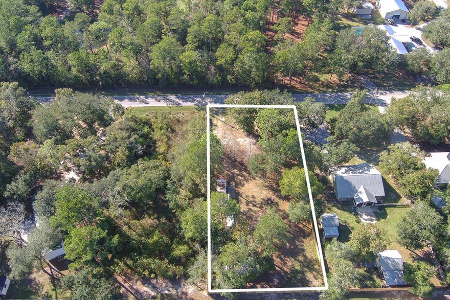 Lowered 10K! This Great 1/2 acre lot - ready to build or put modular home. Water and power in place with Shed and privacy fencing on property. Only needs septic installed. Blocks away from Black Creek for fishing and boating. Beaches are minutes away so you can enjoy shopping, entertainment and restaurants along 30A. Freeport Publix, Taco Bell, McDonalds and more minutes away. Quiet, peaceful non HOA neighborhood to set up your weekend getaway or full -time residence.