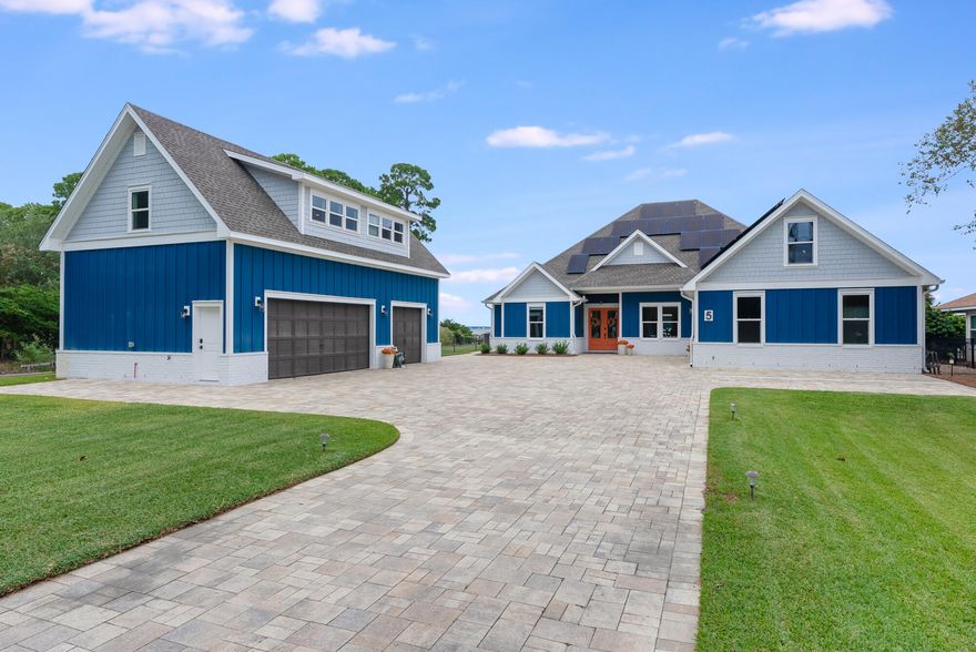 5 Bayshore Drive | Miramar Beach, FloridaBayfront Luxury. Endless Horizons. Effortless Living No HOAAlong the tranquil expanse of Choctawhatchee Bay, 5 Bayshore Drive stands as a masterwork of modern coastal living -- a residence where architecture, light, and landscape exist in effortless harmony.Each morning, the water glimmers just beyond your window. Each evening, the horizon melts into gold. Between those moments, life here unfolds in quiet rhythm -- refined yet relaxed, elegant yet entirely at ease. Inside, over 3,800 square feet of curated interiors celebrate both form and function. Sunlight dances across open living spaces designed for connection -- where walls of glass invite the bay to become part of the decor, and every room seems to exhale. At the heart of the home, a large kitchen anchors the home with a spirit of gathering. Mornings unfold at the breakfast bar as sunlight spills across stone countertops making it as inviting for casual mornings as for intimate evenings. Just imagine preparing breakfast in this gorgeous kitchen with plenty of storage, and a breakfast bar perfect for serving guests before heading to the beach. The adjacent living and dining spaces open to a covered patio and a custom saltwater pool that mirrors the colors of the dusk sky creating a seamless flow from indoors to open air perfect for entertaining or quiet reflection. Spaces flow with intention designed for conversation, celebration, and calm.

The main home's 4 large bedrooms, all include a private en suite offering serenity and style in equal measure. Throughout, every detail feels intentional: the textures, the tones, the light that changes with the day.

Beyond the doors, the landscape is a world of its own. Set on nearly half an acre with 100 feet of direct bay frontage, the property invites endless discovery. The private dock includes a covered boat slip and 6,000 lb boat lift, 2 jet ski lifts, an equipment cabinet, a swim deck and an elevated sunset deck - the perfect place to unwind as the sky transforms into a canvas of vibrant color each evening. 

Additionally, you'll find an inviting outdoor shower and fenced grounds thoughtfully designed for both privacy and play. The property also showcases an enclosed summer kitchen perfectly tailored to complement the home's architectural style. This charming multi-purpose outdoor pavilion offers the perfect blend of function and fun. Designed as a fully equipped grilling station, bar, and social lounge, it features a roll-up serving window with bar seating, a full-size refrigerator, built-in counter space, stainless sink, and mounted TVideal for game days, sunset cocktails, and weekend cookouts. The covered structure keeps the party going rain or shine, while the open deck creates a seamless flow to the surrounding lawn and waterfront views. Whether you're hosting friends or unwinding by the bay, this versatile space delivers the ultimate outdoor entertaining experience.

The homes 5 garage spaces are divided between an attached 2 car garage and an additional detached 3-car garage with a beautifully appointed 1 bedroom fully-furnished carriage house that extends hospitality or income potential. The eco-friendly solar panels bring modern sustainability to the fore.

Here, every day feels beautifully complete. Paddle at sunrise as dolphins play nearby. Spend lazy afternoons exploring Choctawhatchee Bay or the gulf's sugar-white sands. Then return home to sunsets that set the bay alight in shades of amber and rose.
Moments from Regatta Bay Golf & Yacht Club, Grand Boulevard, and the region's finest dining and boutiques, 5 Bayshore Drive is both a sanctuary and a statement - a place where the beauty of Miramar Beach meets the art of living well.

A place to gather.
A place to breathe.
A place to belong.

Welcome to 5 Bayshore Drive your sanctuary on the bay
