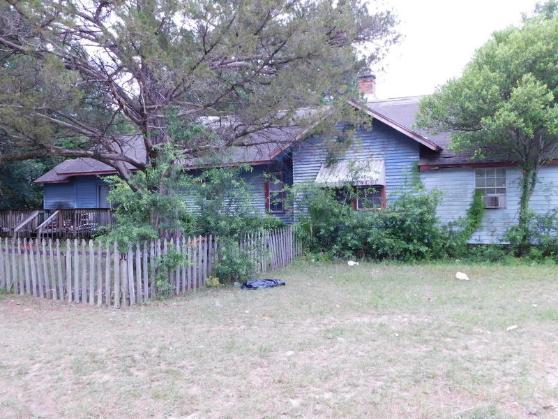 Commercial and retail would be the Highest and best use for this property. High visibility and a large corner lot gives this property multiple uses. It may also be a possibility to split this lot in 2- 50 x 140 lots. Currently zones SFR but commercial is all around it and it appears to be a great spot to establish a retail, medical, service or restaurant type business., etc. Grab this investment while it exists at a very aggressive price. The older home is in high disrepair and could be renovated or hauled away. SOLD AS IS, where is , in it's current condition. The front porch was enclosed and could be opened up and brought back to the original home with a vision and hard work.