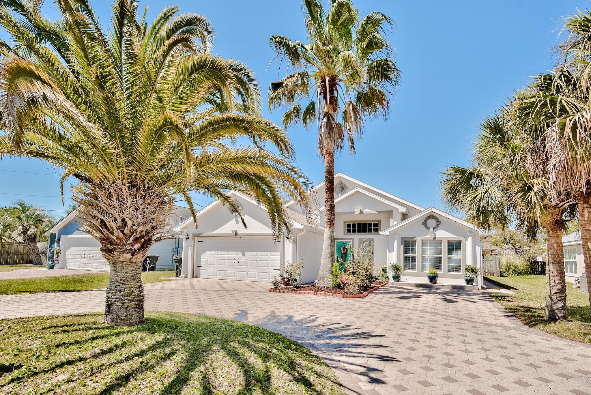 Looking for a hidden treasure in Miramar Beach? Look no further! This beautifully maintained home is conveniently located between the sugary-white beaches and the bay in an exclusive community featuring only 16 homes and a community pool! Perfect for a second home or full-time residence, this home is made for entertaining with its split-bedroom, open floor plan and vaulted ceilings. Move in ready, this spacious home has been freshly painted, bedrooms have new flooring and the living room features travertine & marble flooring. The large kitchen and dining area is perfect for the aspiring chef and the circular brick paver driveway will accommodate all of your guests. Enjoy the serenity of the Florida room and privately fenced in backyard, large enough for a pool.