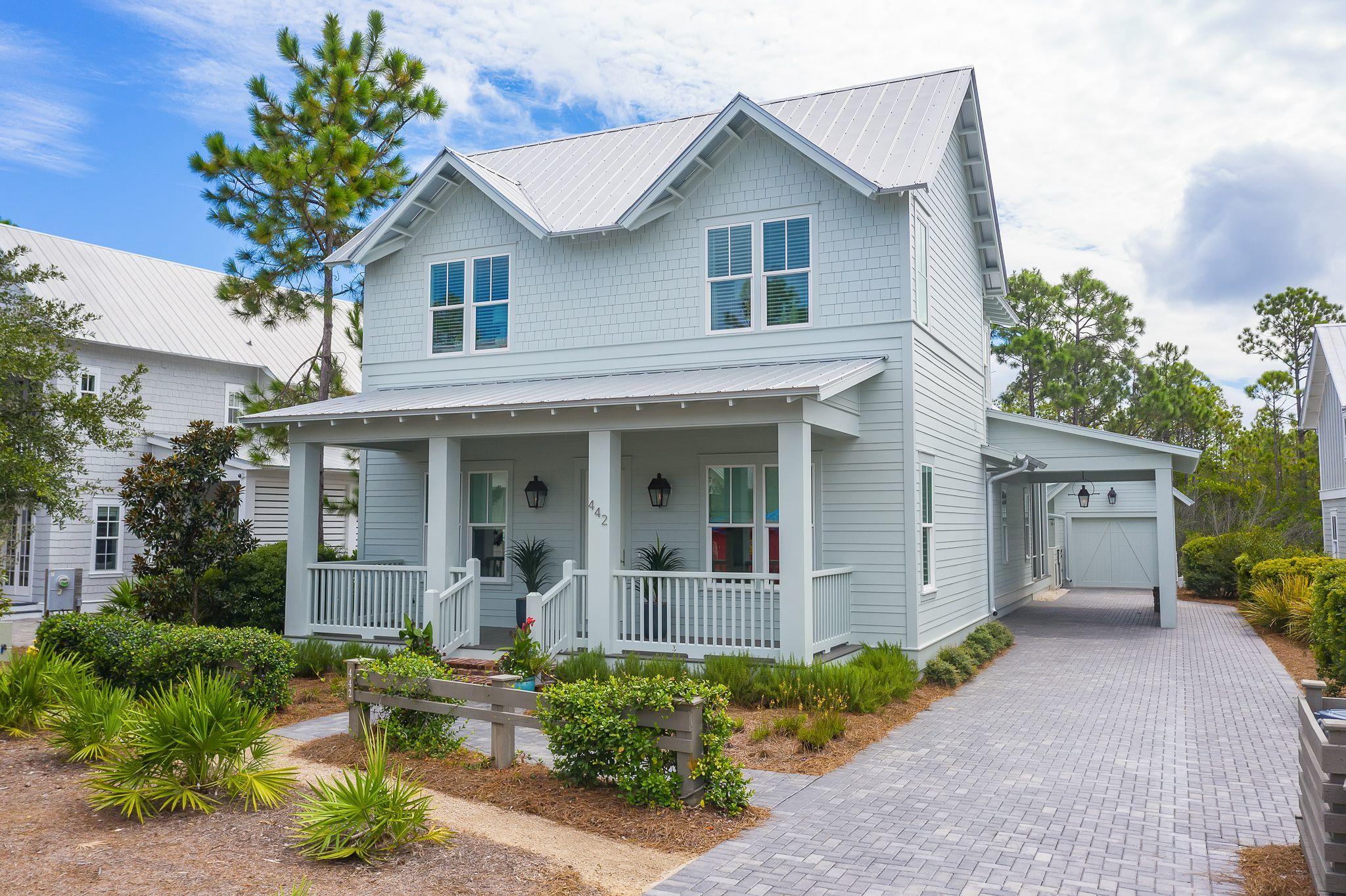 This 5 Bedroom, 4 bath house in phase 4 of Watercolor is beachy elegance at its best! This home offers ample parking on the large paver driveway, a car port, also a one car detached garage, and a large screened in porch that overlooks its own private pool and spa that backs to nature preserve. The entire interior of this home has been freshly painted and the Calcutta Gold marble counter tops have been refinished as well. The kitchen offers an over sized island with seating for 4, wolf and subzero appliances to include a wall oven, gas cook top, custom hood cover, dishwasher and counter to ceiling marble herringbone back splash. The kitchen overlooks the living area with includes a wet bar complete with an ice maker and wine refrigerator.The kitchen also opens to the dining room with