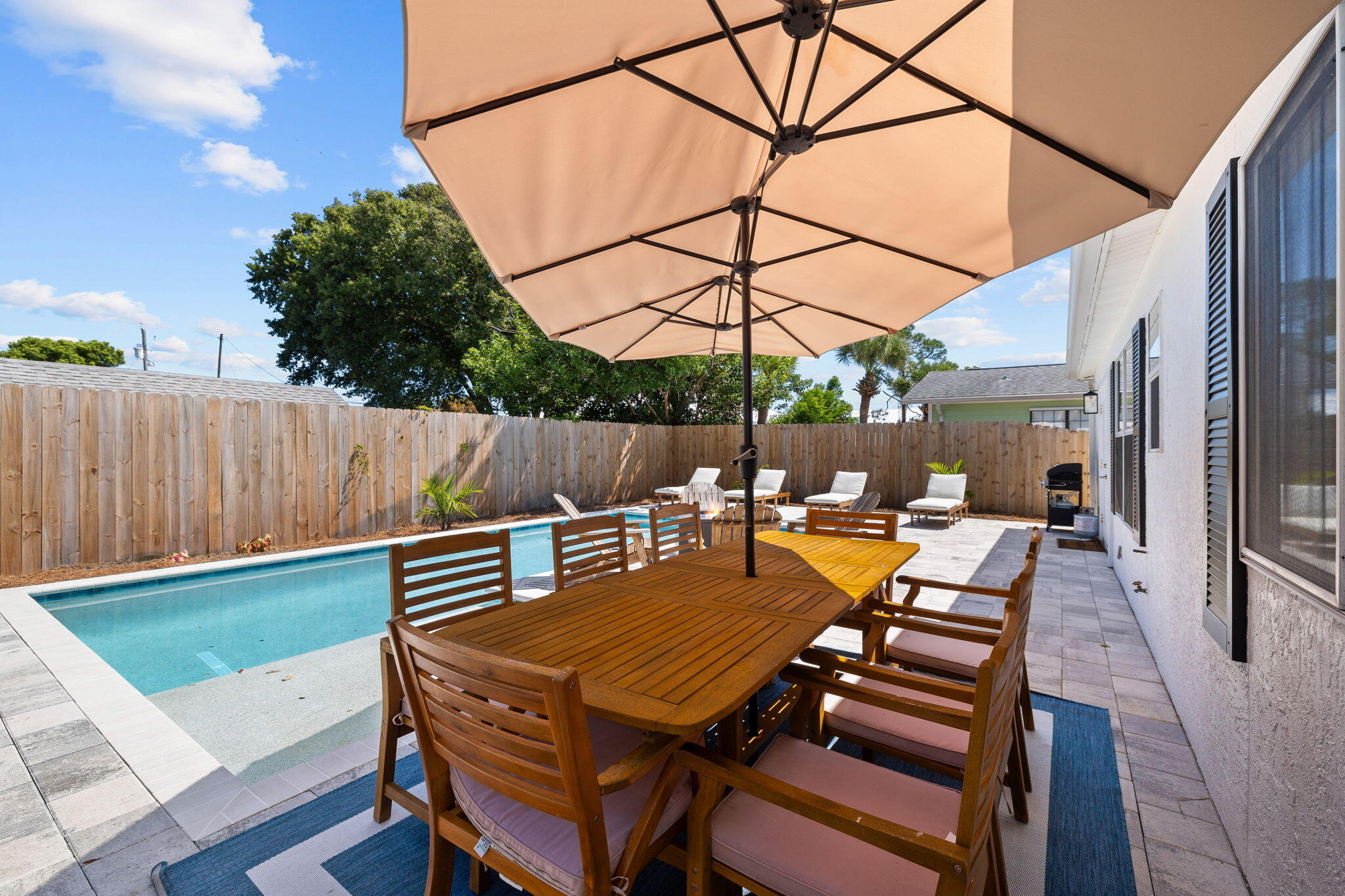 Experience an elite coastal lifestyle only seven minutes from 30A! This peaceful haven is positioned on a beautiful street just a short golf cart ride from the beach. This stunning getaway can be a quaint escape for you and your family as well as a top-producing rental property with projections at $72,988 and cash on cash return projections at 6% per year. Beautifully designed, the home offers a modern blend of indoor and outdoor living spaces. Serving as a perfect seaside retreat, 21516 Dolphin Avenue features easy public beach access and a private heated pool. The chef's kitchen showcases floating shelves, quartz countertops, and a stainless steel kitchen hood. Positioned just minutes from Alys Beach, Rosemary Beach and Seacrest Beach, this home sits in a perfect location to enjoy a peaceful sanctuary while also being close to all the top dining, shopping and entertainment options on the east end of 30A. Offered fully-furnished, this property can be a lucrative investment property and comes with strong rental history. Explore this sanctuary designed for relaxation, connection and unforgettable memories on the coast!