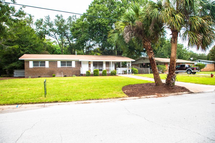 This will NOT last long! The most affordable house in Fort Walton Beach and Seller is offering a $5,500 Upgrading Allowance to the future owner! This 3 bedroom 2 bath has a rare wood deck/front porch and an open kitchen! It has a dining room and a large family room. It has been recently painted and is ready for you...the new owner! The whole yard has been recently & professionally landscaped and is ready for family time, Bar-B-Q's and sports! It also has an outside workshop! Take the $5,500 buyers allowance and make this home your own. Upgrade/Design it to your heart's desire. This house is located just steps away from locals schools and within 15 mins of both military bases. Hurry - won't last long!