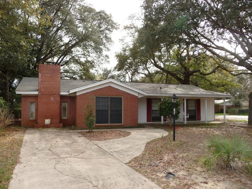 3 bedroom 2 bath home with selected updates in the center of Niceville, close to the highly sought after schools, shopping, Eglin AFB, and the Beaches of Destin. The seller has upgraded the Master bedroom Suite with exquisite detail with crown molding, base boards, and recessed lighting. Master bathroom has been upgraded with a double vanity, new tile shower with multiple shower heads, new toilet, and tile flooring. The hall and two bedrooms have beautifully refinished real hardwood flooring. There is a large brick fireplace in the spacious living room, next to the formal living room. The formal dining area leads to the screened in porch overlooking your large back yard with detached garage and extra parking area for your boat. Copper wiring throughout, newer roof, newer carpet, and