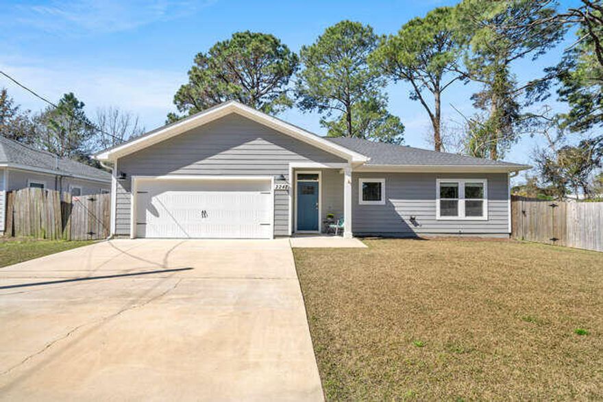 Gorgeous 3 bedroom and 2 bath home built in 2019 yr in Navarre, FL! White sandy beaches, restaurants, and shopping are just around the corner. Enter this contemporary home through the foyer and notice there is an open and split floor plan. The kitchen opens to the dining and living room and the primary bedroom is separate from the guest rooms! The kitchen features stainless appliances to include the side by side refrigerator with ice maker, the built in microwave, slide in stove and dishwasher. There are custom, white, shaker cabinets with crown and quartz countertops. There is an elegant all white tiled backsplash.