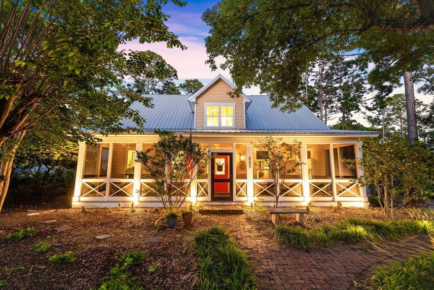Nestled within the serene enclave of Sugarwood, this cottage epitomizes coastal living in the heart of Seagrove Beach. Just a leisurely stroll away from the pristine shoreline of the Gulf of Mexico, this home offers a tranquil retreat in a prime location.Set on a generously-sized lot adorned with lush landscaping and fragrant citrus trees, this residence welcomes you with a charming screened front porch--an idyllic spot to savor the refreshing coastal breeze. Step inside to discover a meticulously designed interior boasting three bedrooms, including a master suite on the main level, complemented by a convenient half bath.Enhancing the ambiance, warm wood planked floors imported from France grace the inviting living room, accentuated by a cozy fireplace--an ideal setting for