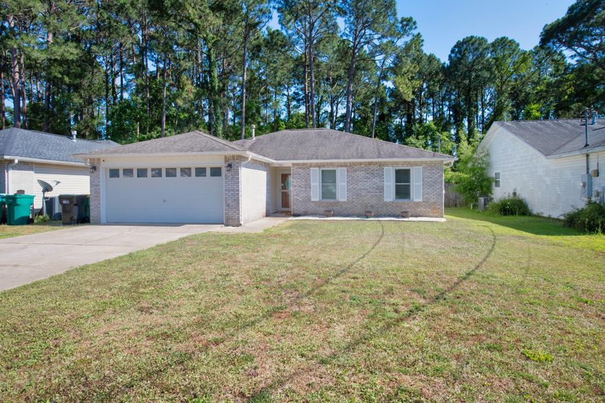 Beautifully renovated home in the heart of Niceville. This home features upgraded flooring in main areas, updated lighting throughout, granite countertops as well as stainless steel appliances in kitchen, oversized bedrooms, an open concept floor plan, & 2 car garage! Roof is 2013, Water Heater 2017, and AC 2014. The well sized backyard is fully fenced as well as features a covered back porch area. Schedule a showing today!