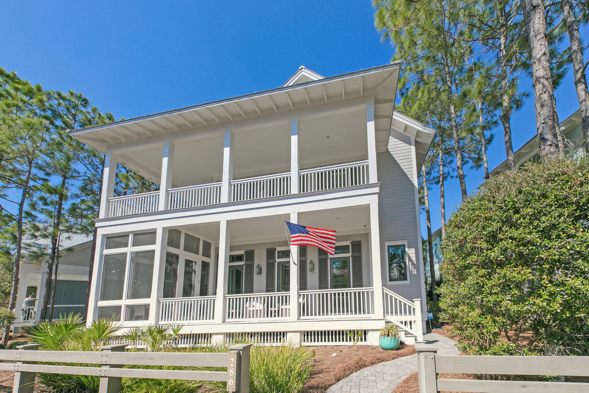 Pristine Watercolor home conveniently located on Pine Needle with easy access to amenities as well as Watercolor Crossings shopping and dining.  Built by Borges Brooks, this custom home includes features like pecky cypress accents, reclaimed beams, first floor master, laundry and an office, making it ideal for full time living.  The living room boasts a fireplace, wet bar including a wine fridge. The second floor as two bedrooms, three baths and a large sitting area that could be converted into a bunk room.  Both floors have expansive porches.  The oversized two car garage with a carriage house above.  The carriage house includes a kitchen, walk in closet and generous sized bath.  Home was recently repainted inside and out, in superb condition.