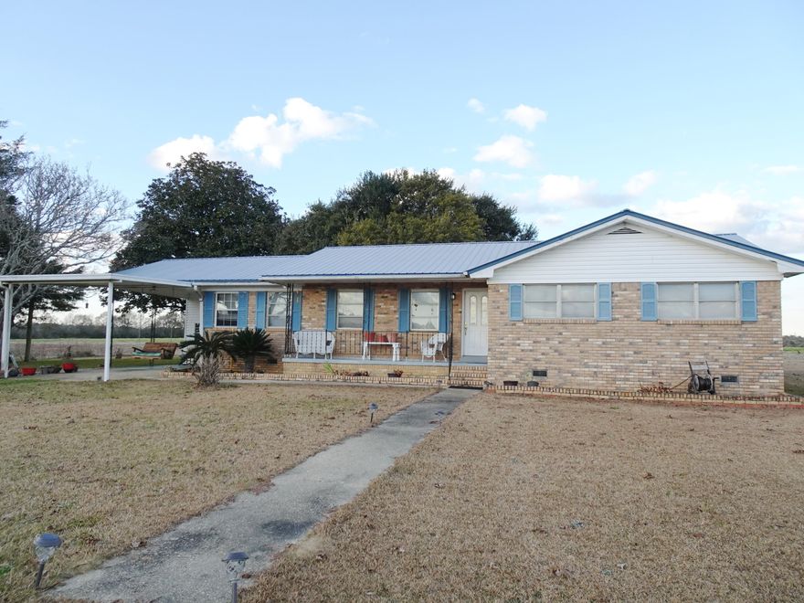 Looking for country living ? This is it. Located just South of Paxton with paved road frontage on 2.3 acres, this 4 bedroom, 2 bath Brick Home offers the space you will want. 1,897 heated and cooled home plus storage room, carport and covered front porch for a total of 2,493 under roof. Home features a formal living/dining room, family room, kitchen with a breakfast bar plus 4 bedrooms and 2 full baths. Original Oak floors are in the living/dining room.  Spacious master bedroom is 17 x 15'3 with a wall of closets and built in drawers. Property also includes a shed and barn. The barn does need work. This home is located in the Paxton School District.