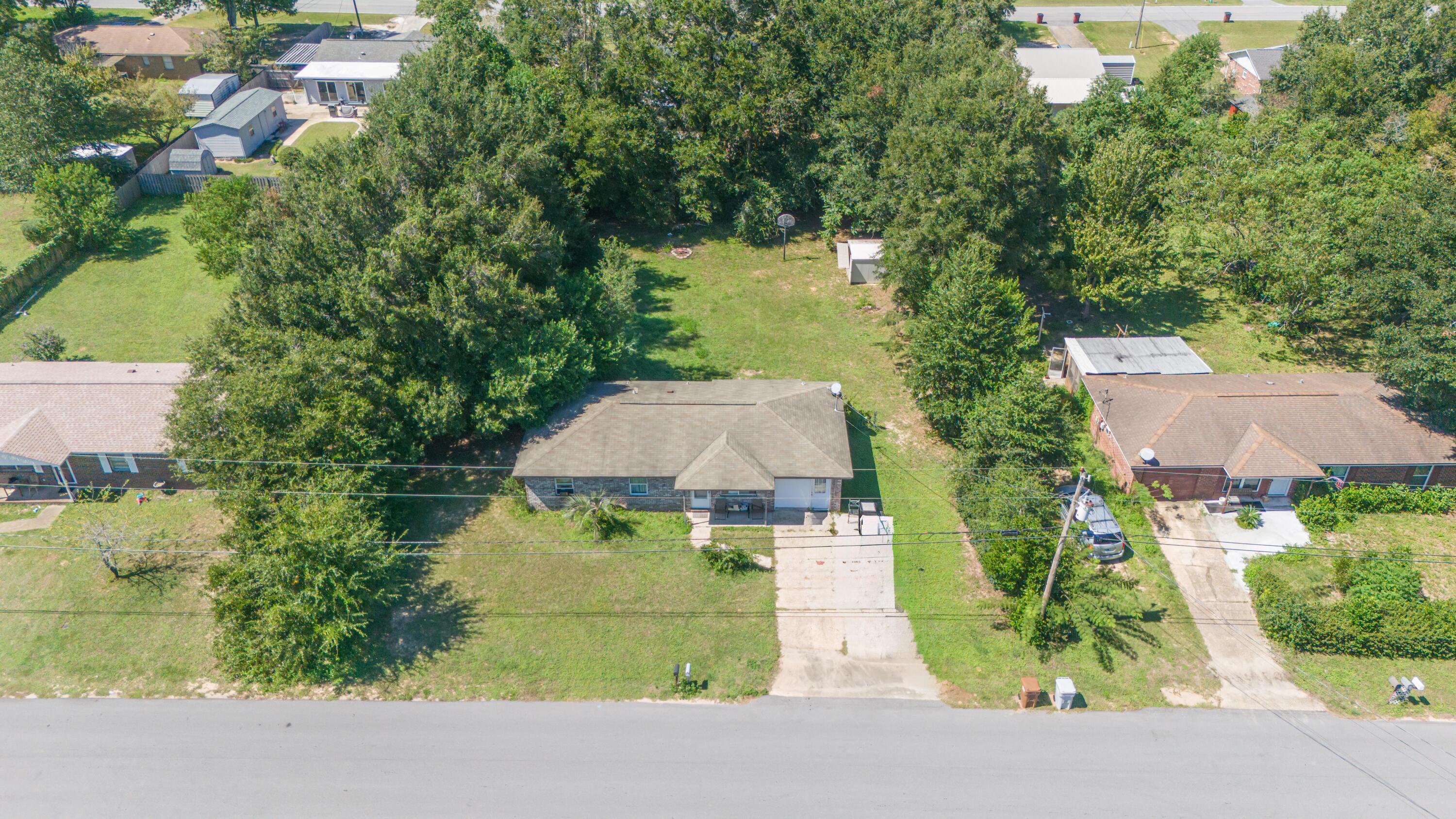 Welcome to your new home! Nestled in the heart of Milton, Florida, this delightful home offers comfort and convenience. It is located in a neighborhood close to schools, shopping, and various dining options. This home has all the convenience and quiet you are looking for.The home has several updates, including new flooring, kitchen backsplash, and paint. However, it needs further work and polishing to restore its former glory. The seller already has many of the materials required. The seller is also willing to provide an acceptable new roof offer.