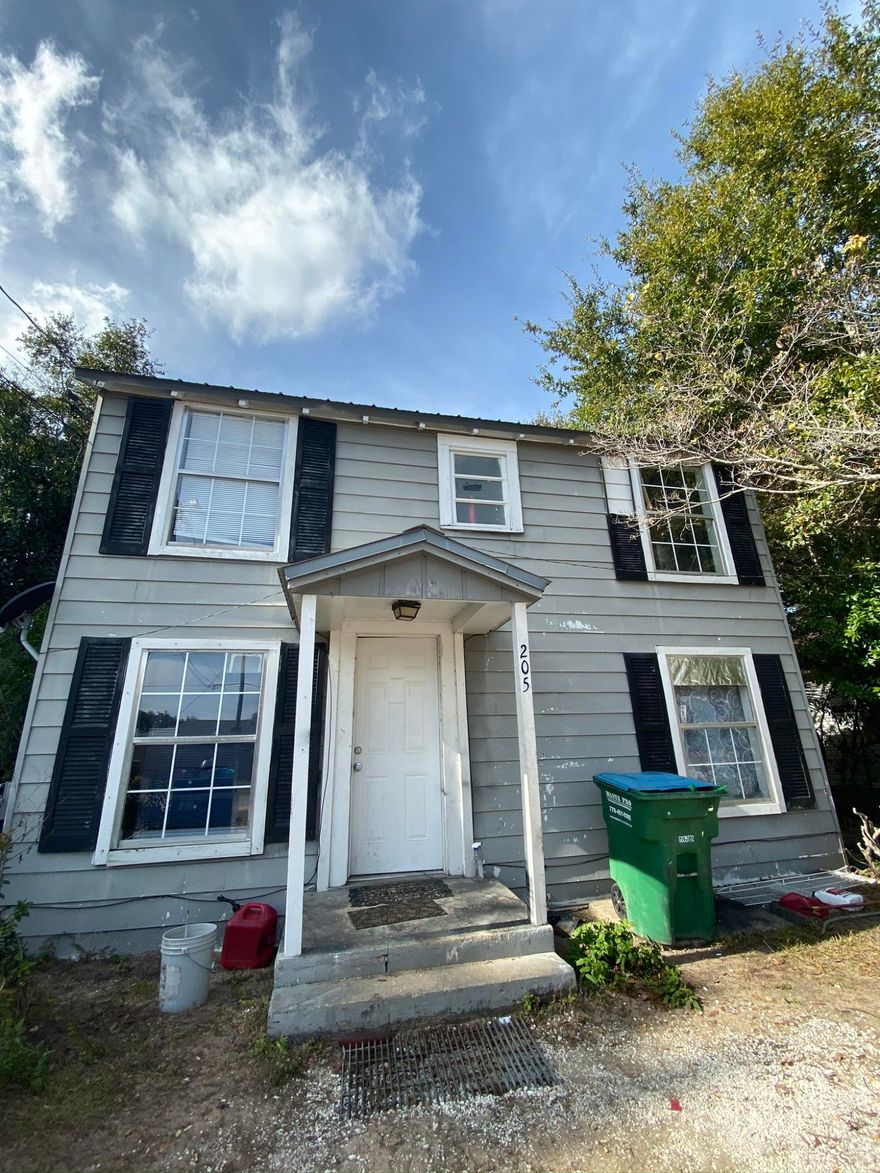 This home is affordable! The inside has beige tile thru out the downstairs. Large living room. 1/2 bath downstairs and features a pedestal sink. Kitchen with light maple cabinets, ''Butter Rum '' granite looking counter tops, double bowl stainless sink. Tumbled marble backsplash. Eat in area is roomy too. Inside laundry area, Upstairs is two large bedrooms and one full bath. Large backyard. Needs work. But with some TLC it could be a doll house on a great lot!