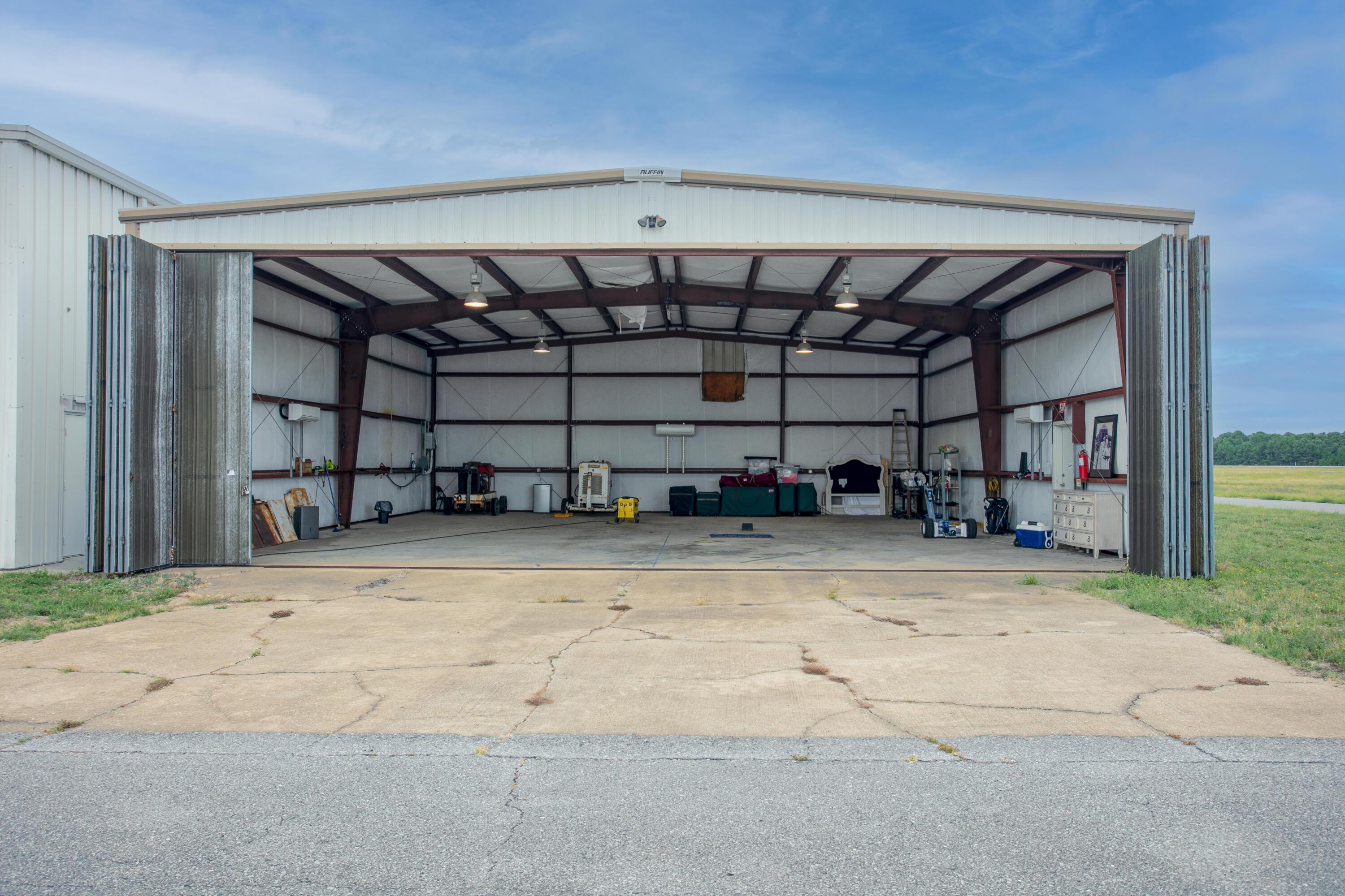 The Destin Executive Airport (DTS), located in the heart of Destin, Florida, rarely offers private leaseholder interest in hangar opportunities. We are now offering one of the most price-effective airplane hangars at DTS. The related ground lease matures in approximately (10)-years. The conditioned metal building contains manual swing doors and is oriented at a prime end-cap location, adjacent to the taxiway, and convenient to the FBO to utilize the host of supporting aviation services. Please inquire for further details and to schedule a private showing. Hangar Depth: 50' Height in Center of Hangar: 15' Swing-Door Opening Width: 43' Tail Clearance: 14'