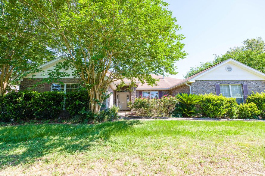 *Back on the market* Buyers financing fell through. This four bedroom, three bath home offers a split floor plan with TWO living spaces. This home has tons of natural lighting that comes through the triple sliding glass door in the first living space or next to the fireplace in the second living space. Need office space or room for the kids to work on homework, no problem the built in desk in the kitchen offers that. The covered porch with ceiling fans and white vinyl privacy fence allow for you to sit comfortably outside. This home is in easy walking distance to the tennis courts or community swimming pool. All appliances including the washer and dryer convey as is.