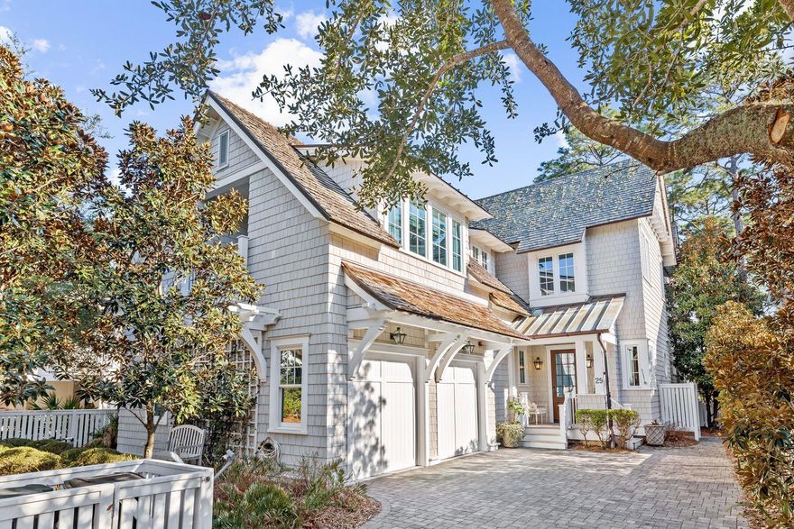The distinctive architecture of T.S. Adams is immediately evident in this characterful WaterSound beach house. Boasting a typical Cape Cod/Nantucket appearance, this beautiful residence has a shingle-clad exterior, a romantic Juliet balcony, and a host of dormer windows creating added appeal. Three floors of spacious living are reached by stairs or elevator, and there's an additional surprise with a fourth-floor tower room. Equipped with a wet bar and refrigerator, it's a unique den for families to watch their favorite movies on the hidden-lift TV or enjoy stunning sunset views from the adjoining open deck. Wire-brushed oak floors are just one example of the incredible attention to detail that this home showcases. The open-concept living space is enhanced by warm wood tones and modern finishes, creating a seamless blend of charm and functionality. The great room offers a large open floor plan beneath a soaring coffered ceiling with rich wood panels picked out by sturdy white beams. A brick fireplace with a solid wood mantlepiece creates a cozy sitting area for putting your feet up, while the dining area is amply spacious for family celebrations and entertaining. The entire room is flooded with natural light through a series of tall windows and transoms. French doors open onto a private covered deck with a summer kitchen, perfect for barbecues and alfresco dining. The gourmet kitchen is truly special, with a lavish marble-topped island, three sinks, multiple cabinets and upscale Wolf and Sub-Zero appliances. It extends around a corner into an open butler's pantry/prep area, complete with a wine refrigerator and ice maker. Six guests can sit at the bar for snacks or hors d'oeuvres before dinner. Five bedrooms include a stunning first-floor master suite with the same coffered ceiling, board-and-batten walls and a generous walk-in closet with custom built-ins. The spa-like master bath is truly magnificent, with white marble tiles complementing the standalone tub. The twin vanity incorporates a make-up area and a mirror TV. The upper floors include an additional living area and an oversized bunk room for four with lots of elbow room and storage space for toys and treasures. Three additional guest bedrooms, all with ensuite baths, include a second floor master. It has a wood-beamed ceiling and French doors opening onto an upper porch with a charming swing seat. Where better to spend quiet time reading and enjoying the sights and sounds of nature? Six bathrooms provide everyone with their own privacy. A cabin-like office (one of two) creates a valuable space for those working from home. The outdoor area is exceptionally private, allowing you to enjoy the peaceful surroundings from multiple screened and covered porches. A large two-car garage offers ample space to store golf carts, bicycles and beach chairs when not in use. A whole-home security system provides additional peace of mind. Pocket parks and neighborhood pools allow you to enjoy this exclusive community to the full. There's also a state-of-the-art fitness center and miles of boardwalks leading to one of the most beautiful beaches in South Walton. 