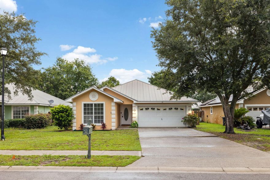 Effortless living meets everyday comfort in this stylish one-story home, perfectly located in Santa Rosa Beach and priced under $400,000. Situated within the amenity-rich community of Driftwood Estates, this three-bedroom, two-bath residence offers a thoughtfully designed split-bedroom layout and 1,592 square feet of open, functional space. Inside, vaulted ceilings and fresh interior paint create a bright and welcoming atmosphere, while new luxury vinyl plank flooring adds both warmth and durability. The kitchen stands out with granite countertops, stainless steel appliances, and ample cabinetry--an inviting space for casual meals or weekend entertaining. The primary suite is tucked away for privacy and features its own ensuite bath, with two guest rooms positioned on the opposite side of the home. A fully fenced backyard offers a secure spot for kids, pets, or peaceful outdoor living, and the two-car garage provides additional storage and convenience. Residents of Driftwood Estates enjoy access to a large resort-style pool, parks with playgrounds, pickleball courts, and a soccer field, all within a short stroll. With close proximity to Grand Boulevard, Sacred Heart Hospital, schools, and the baynot to mention the sugar-white beaches just minutes awaythis home is perfectly placed for enjoying the best of the Emerald Coast. Whether you're looking for a primary residence or a relaxed second home, this move-in-ready property delivers comfort, value, and location.

