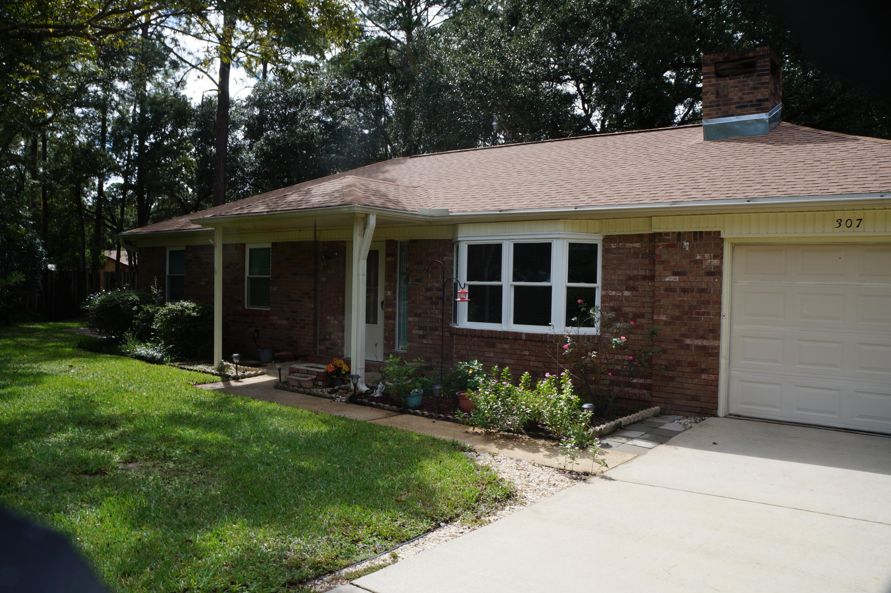 Beautifully Maintained Home with great curb appeal. Super convenient to Eglin AFB and Hurlburt Field! Brand New Roof!! New Water Heater. Copper Wiring! This lovely 3 Bedroom 2 Bath home has a HUGE RV shed with Power and room to house a Boat as well! There is an additional workshop/shed with power. A separate grass driveway that leads to the double gate access for these buildings. The home was expanded over the years to make a larger Living Room with Fireplace and a wonderful Florida Room / Office. There is newer carpet in most of the house and pristine vinyl in the kitchen/dining area. Enclosed Garage and Laundry Room leads to an awesome Covered Back Porch. This beautiful yard is completely fenced. Great opportunity! See it today.Buyer to verify measurements and pertinent info
