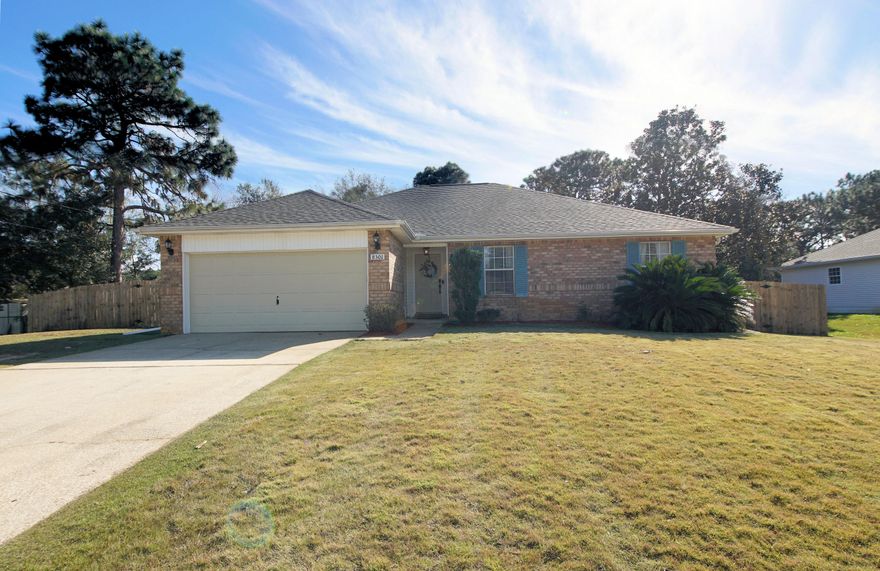 Under contract with kick out clause, accepting back up contracts. Gorgeous, well-maintained, 4 bedroom 2 bath home with 1780 sq ft only minutes to the white sandy beaches, shopping, and restaurants in Navarre, FL! This home sits on .46 acres! The large yard is fenced and features a double gate for easy boat trailer parking. Roof was replaced in 2020, HVAC in 2018, and hot water heater in 2020. The heating and cooling system has a purification system. Enter this lovely home and notice the 10 ft ceilings! The kitchen features a French Door refrigerator, slide in oven/stove, and dishwasher. There is pendant and chandelier lighting, a glass tiled backsplash, and a center island! The dining room opens to the kitchen and living room!