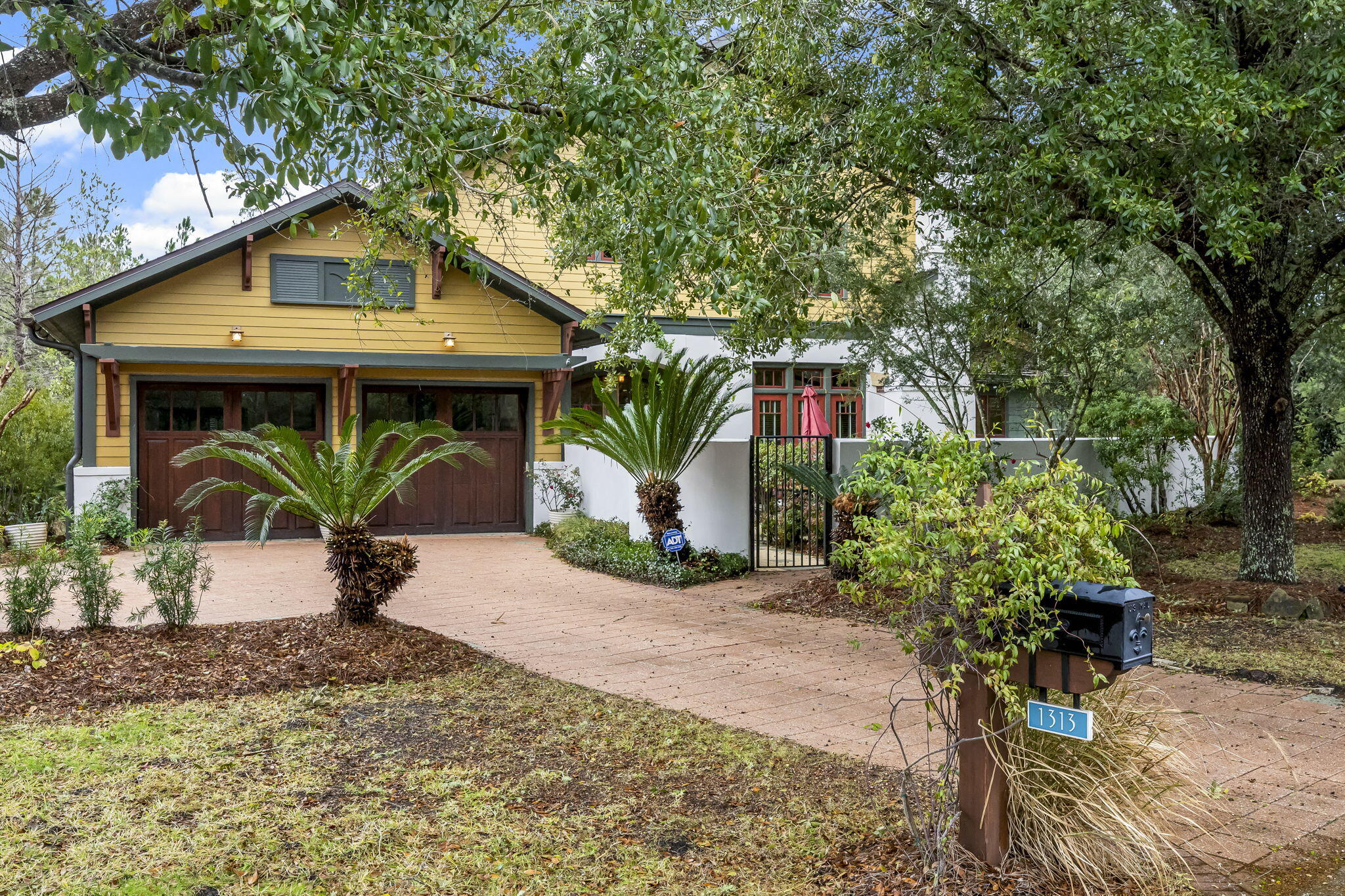 A rare find at 1313 Salamander Trail, tucked behind a privacy wall and lush landscaping with a private, wooded backyard. Enjoy days by the pool and evenings on the patio. This 4 bedroom home offers plenty of space for entertaining and living. The primary bedroom offers a large open floorplan and an updated bathroom with a tile shower and soaking tub. Hardwood floors throughout the main living space and new carpet in the upstairs bedrooms. Additional space off one of the bedrooms has been utilized as a small workout area. Wild Heron is a coastal sanctuary with resort style amenities. Surrounded by lush landscaping & lots of wildlife. Home to the award-winning Sharks Tooth golf course, accessible with a Watersound Club membership.