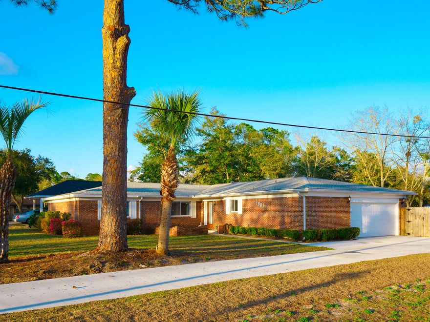 It's a Beautiful day on Hickory! Take a look at this great-size 4BR/2BA home with 2,528 sf that rests on a nice peaceful corner lot in the Valparaiso Pinecrest community. This spectacular home had a new driveway installed last year, a new privacy fenced backyard with a newly built play-house that conveys with the purchase of this home. With fresh paint throughout, there is a brick fireplace with a special wood burning insert in the cozy living room. Into the kitchen you have all original cabinets and counters with an eye-catching counter bar that overlooks the living room. This home has large bedrooms and bathrooms, and a spacious utility/laundry room with wrap-around cabinets. There is so much space to spread out in this property. What a wonderful opportunity, to make this home yours!