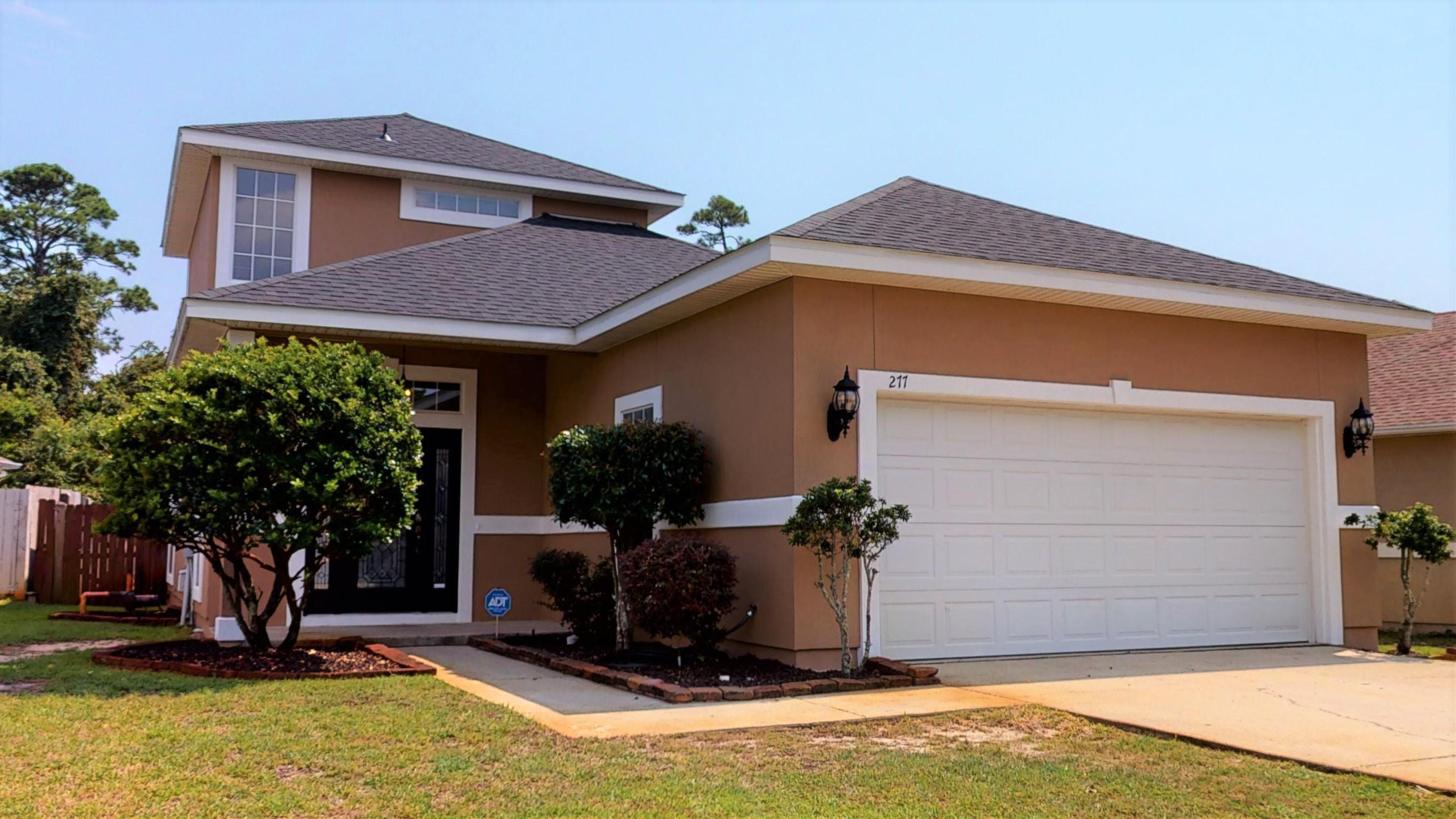 The home is virtually minutes from Hurlburt Field. It is located in Sequoia Estates a gated community featuring water access for the community. 277 Tecumseh Lane has had a new roof in June 2020 and the exterior painted a short time ago. Upon entering your eyes are drawn down the entry hall to the large great room with fireplace, high ceilings and hardwood flooring. French doors lead to immense family room perfect for a play area, entertaining or just family fun. Returning to the great room the open plan kitchen has granite counters a step up serving area as well as stainless appliances. The main floor also has two additional bedrooms, bathroom and a large laundry area. Follow the stairs up to the secluded Master Suite. The fireplace in the master adds a touch of elegance to the master.