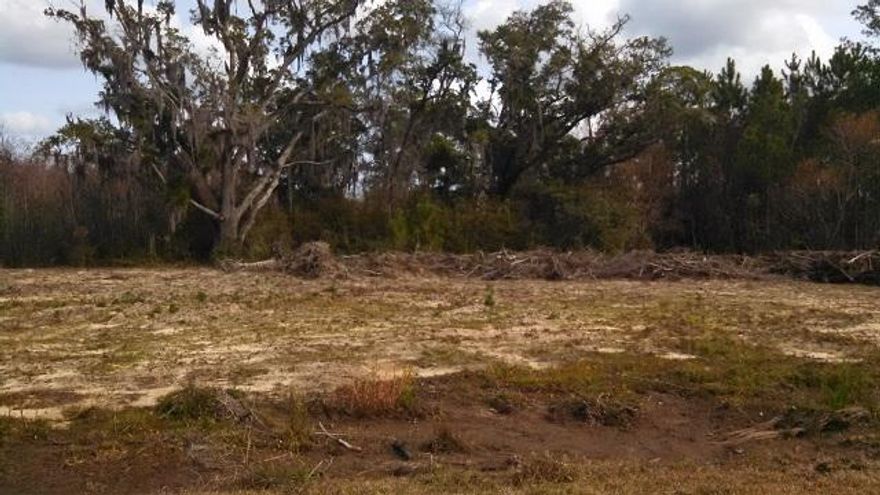 This is a beautiful water view residential lot within the Casa Grande Estate however DOES NOT HAVE HOA FEES attached to this lot. Directly across from the Black Water Bay. This is a family oriented neighborhood with home values from $250K - $1M. Conveniently located-- (3) minutes to Interstate 10, (5) minutes to Hwy 90. Paved streets, underground utilities, offering sewer this Spring 2015. San Ramon Drive fronts the South and the West sides of this lot for a nice circular drive setting. This .74 acre corner lot will make a gorgeous home site for your Dream Home! It's Perfect and Affordable!