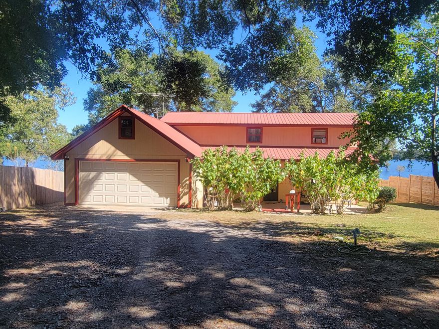 Waterfront home on Lake Holley complete with boat dock and boat house, inground cement pool and fun!  This 2576 sq. ft. home has 4 bedrooms, and 3 baths. Lake Holley is appx. 400 acres of some of the best bream, catfish and bass fishing in the area.  The home has space galore! Has a  20'x24 attached garage, screened back porch just perfect for those relaxing evening watching the sunset.  Easy to view!  It is like having your very own 'mini' resort' complete with  'She Shed' .  Call for an appt.
